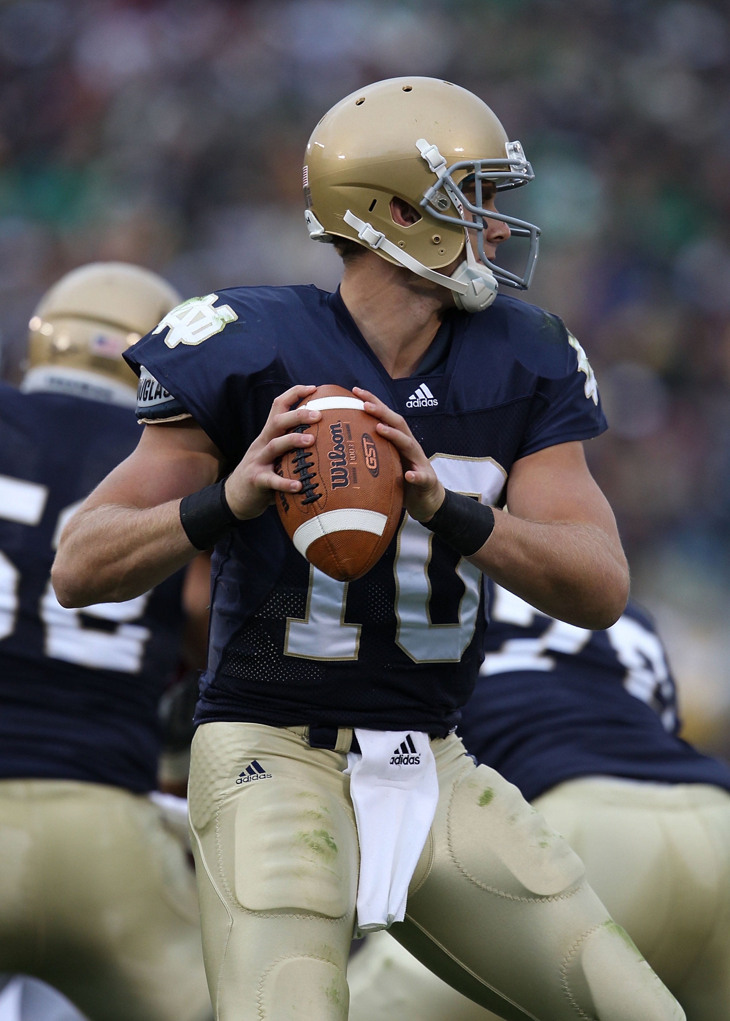 SOUTH BEND, IN - SEPTEMBER 25: Dayne Crist #10 of the Notre Dame Fighting Irish looks for a receiver against the Stanford Cardinal at Notre Dame Stadium on September 25, 2010 in South Bend, Indiana. Stanford defated Notre Dame 37-14.  (Photo by Jonathan D