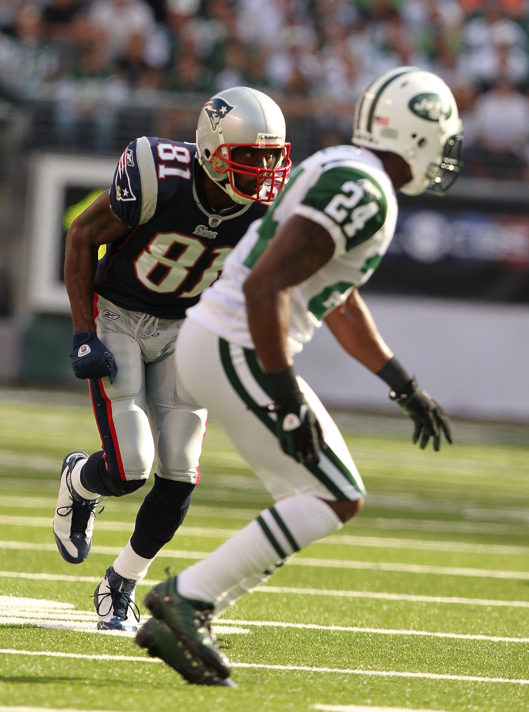 EAST RUTHERFORD, NJ - SEPTEMBER 19:  Darrelle Revis #24 of the New York Jets defends against Randy Moss #81 of the New England Patriots during their  game on September 19, 2010 at the New Meadowlands Stadium  in East Rutherford, New Jersey.  (Photo by Al 