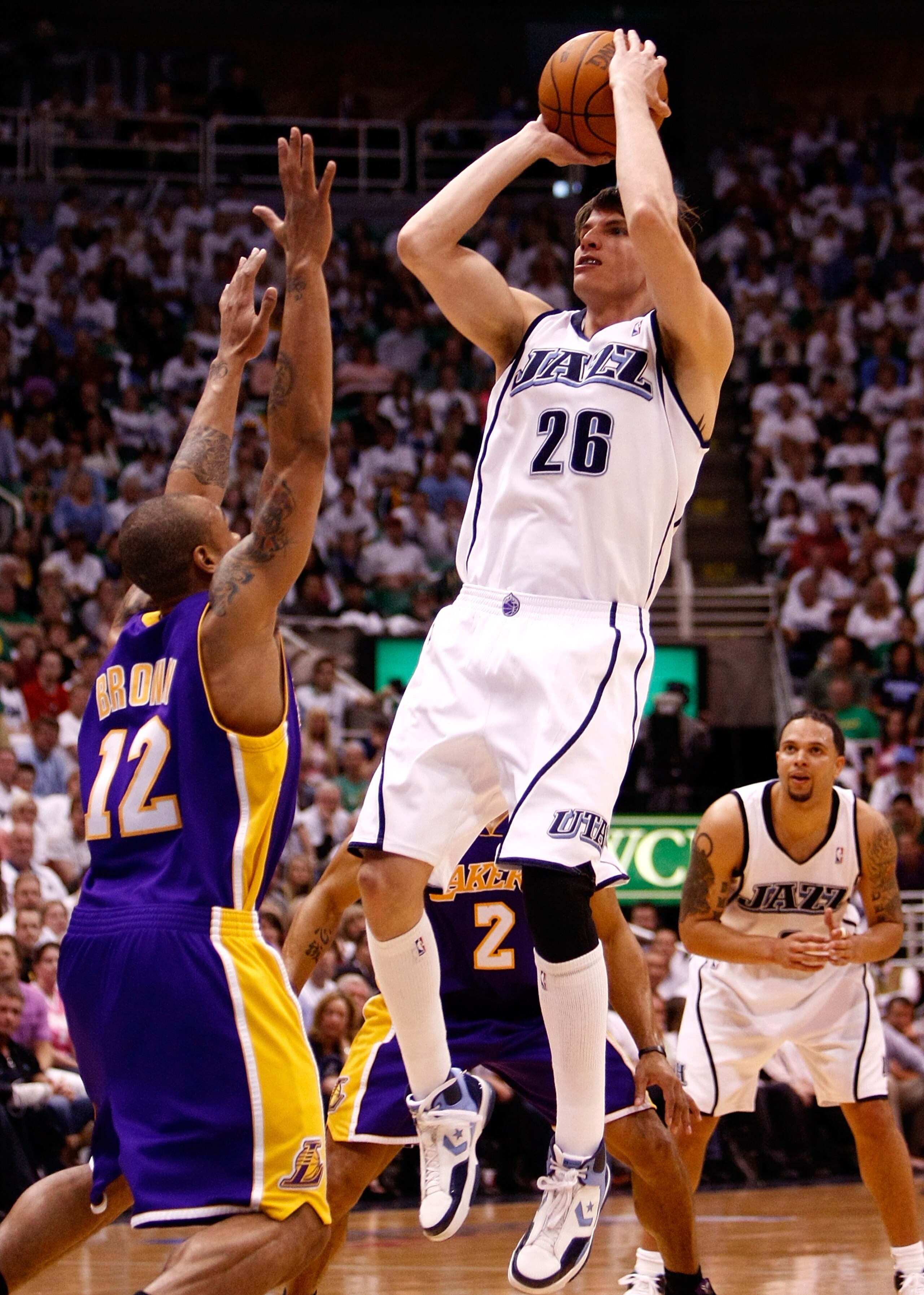 SALT LAKE CITY - MAY 08:  Kyle Korver #26 of the Utah Jazz shoots over Shannon Brown #12 of the Los Angeles Lakers during Game Three of the Western Conference Semifinals of the 2010 NBA Playoffs on May 8, 2010 at Energy Solutions Arena in Salt Lake City, 