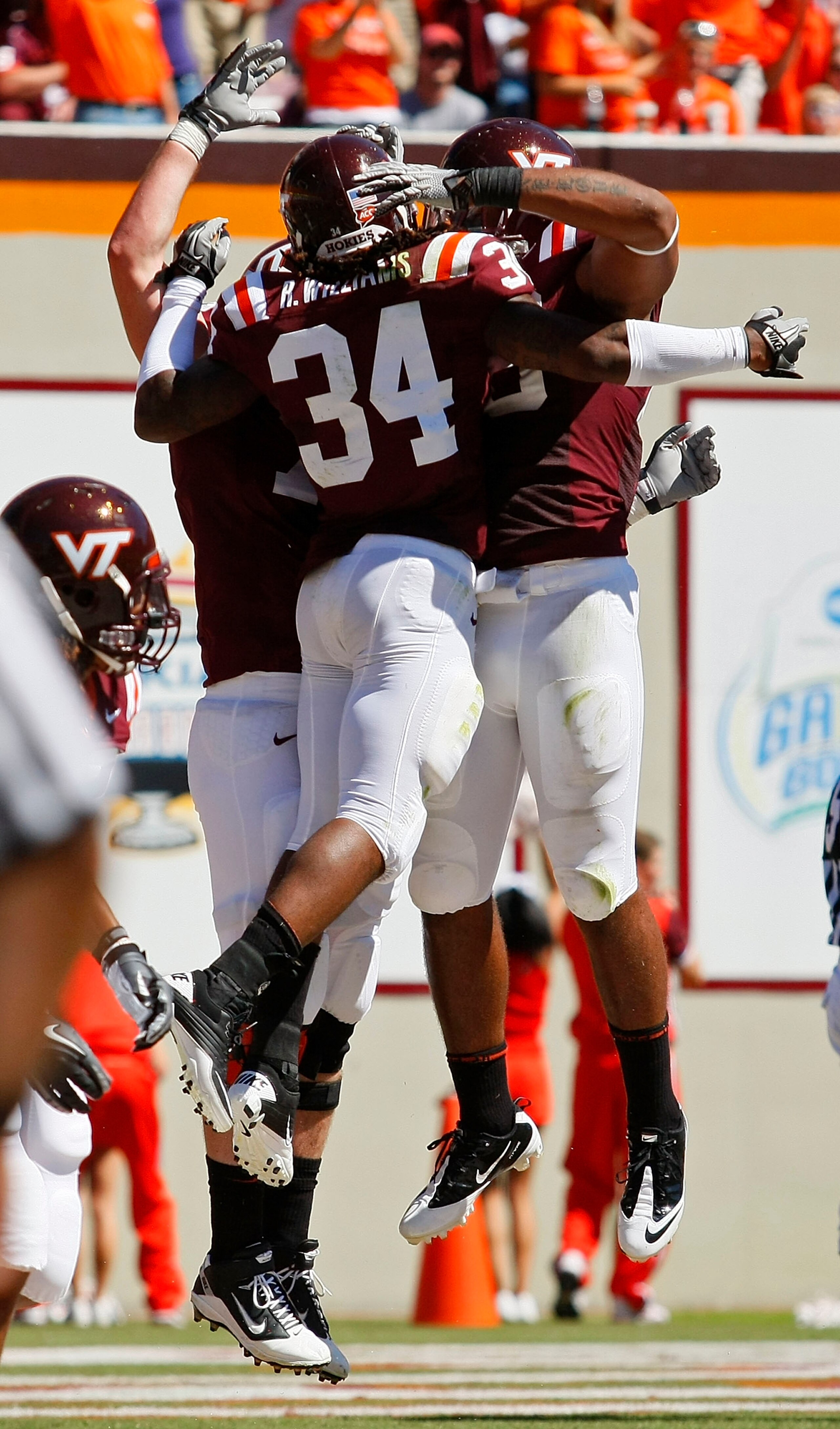 BLACKSBURG, VA - SEPTEMBER 18: Running back Ryan Williams #34 of the Virginia Tech Hokies is congratulated by teammates after scoring a touchdown against the East Carolina Pirates at Lane Stadium on September 18, 2010 in Blacksburg, Virginia.  (Photo by G