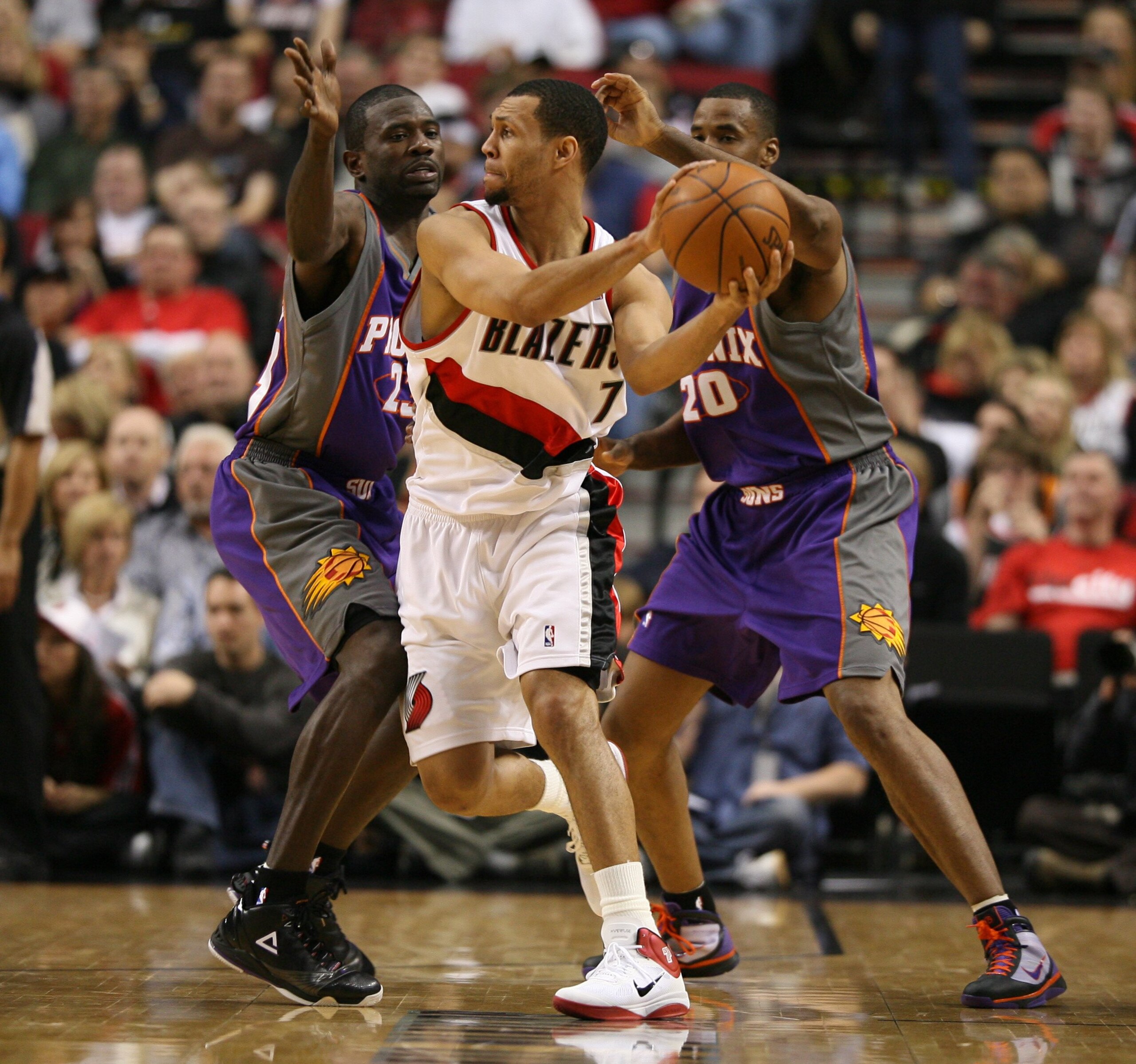 PORTLAND, OR - APRIL 29:  Brandon Roy #7 of the Portland Trail Blazers in action against Jason Richardson #23 and Jarron Collins #20 of the Phoenix Suns during Game Six of the Western Conference Quarterfinals of the NBA Playoffs on April 29, 2010 at the R