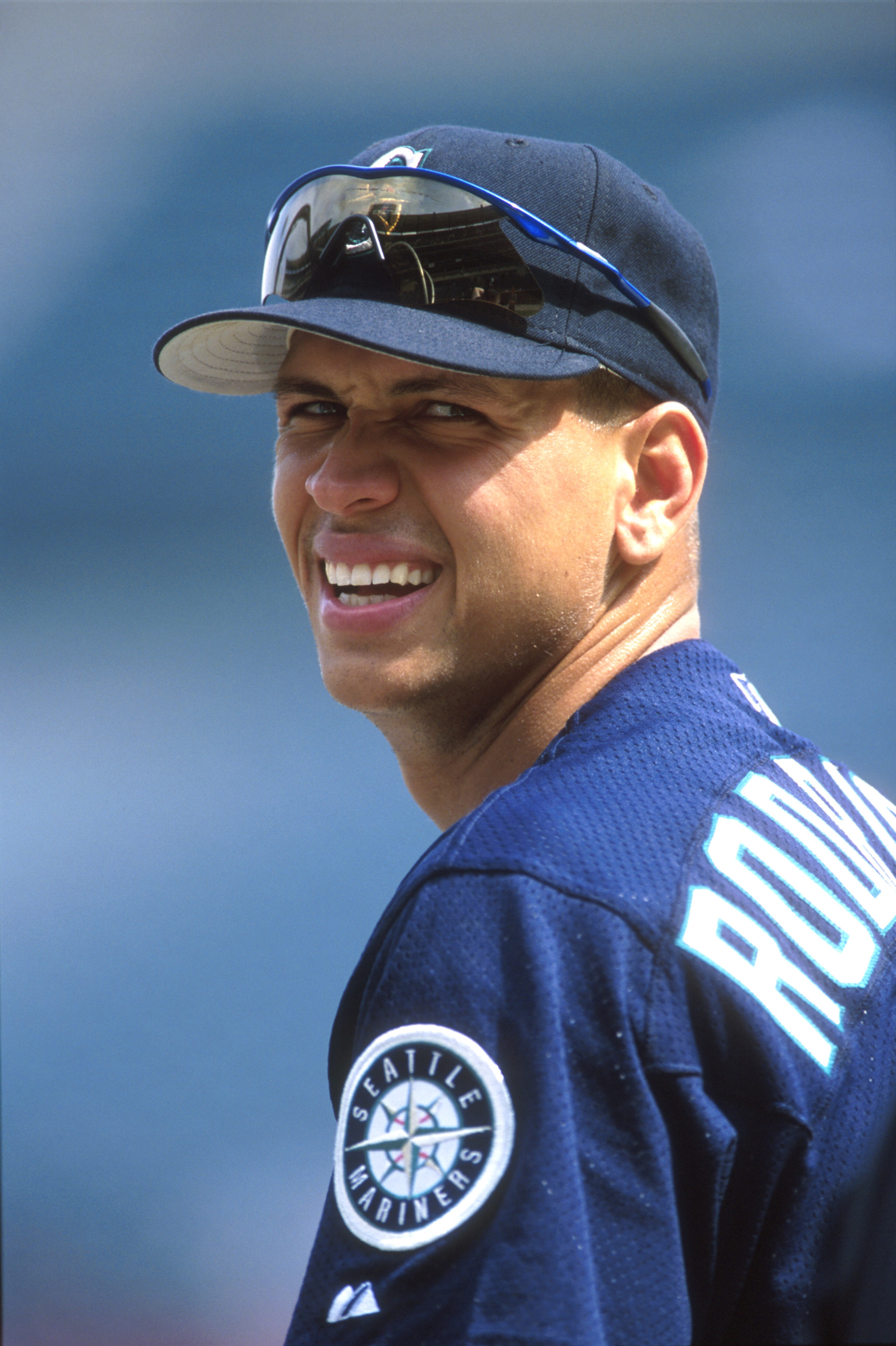 30 Sep 2000:  Alex Rodriguez #3 of the Seattle Mariners reacts to a teammates joke during their game against the Anaheim Angels at Edison Field in Anaheim, California. The Mariners defeated the Angels 21-9. Mandatory Credit: Jeff Gross/ALLSPORT