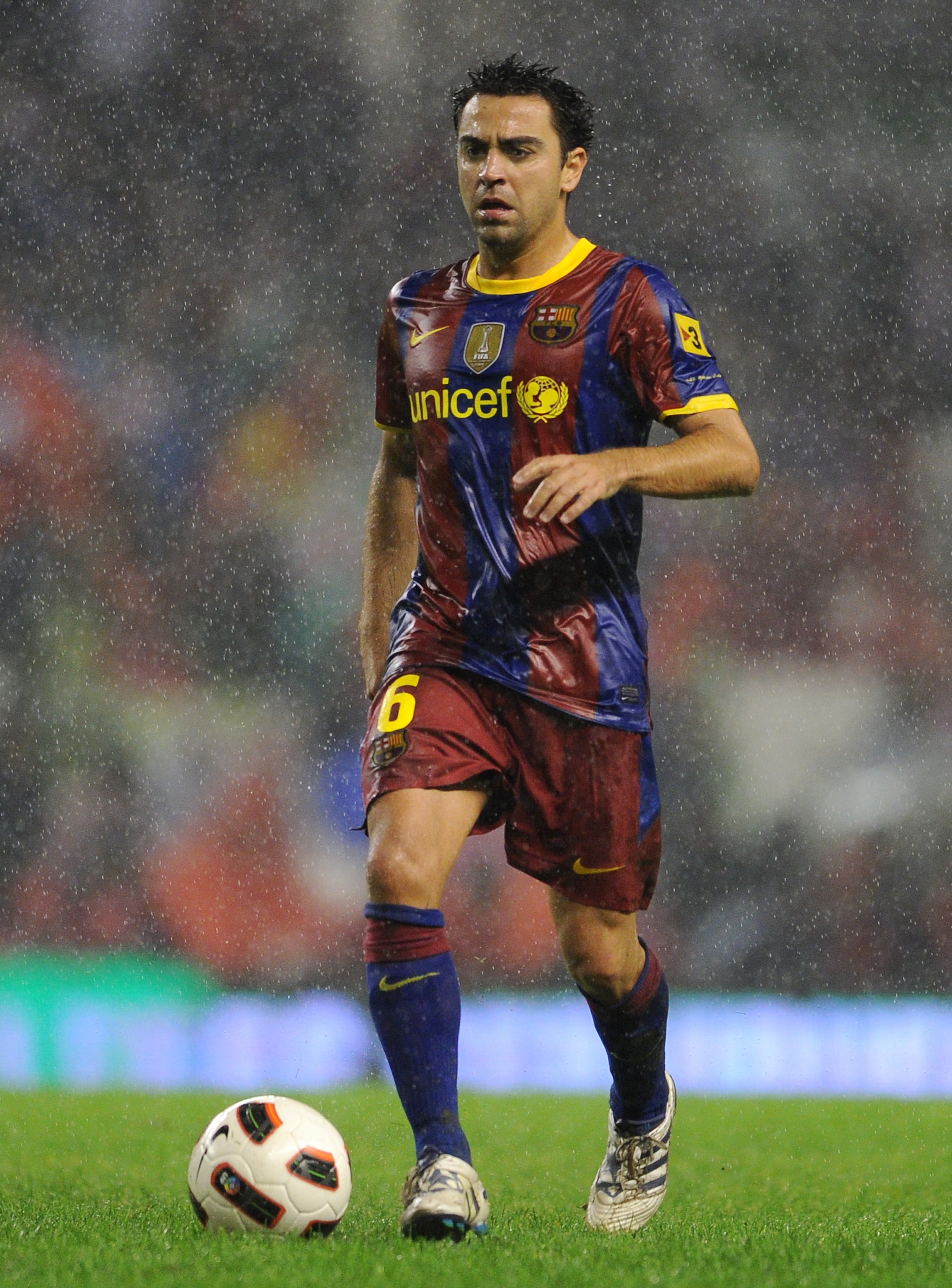 BILBAO, SPAIN - SEPTEMBER 25: Xavi Hernandez of Barcelona runs with the ball during the La Liga match between Athletic Bilbao and Barcelona at the San Mames Stadium on September 25, 2010 in Bilbao, Spain. Barcelona won the match 3-1. (Photo by Jasper Ju BILBAO, SPAIN - SEPTEMBER 25: Xavi Hernandez of Barcelona runs with the ball during the La Liga match between Athletic Bilbao and Barcelona at the San Mames Stadium on September 25, 2010 in Bilbao, Spain. Barcelona won the match 3-1. (Photo by Jasper Ju