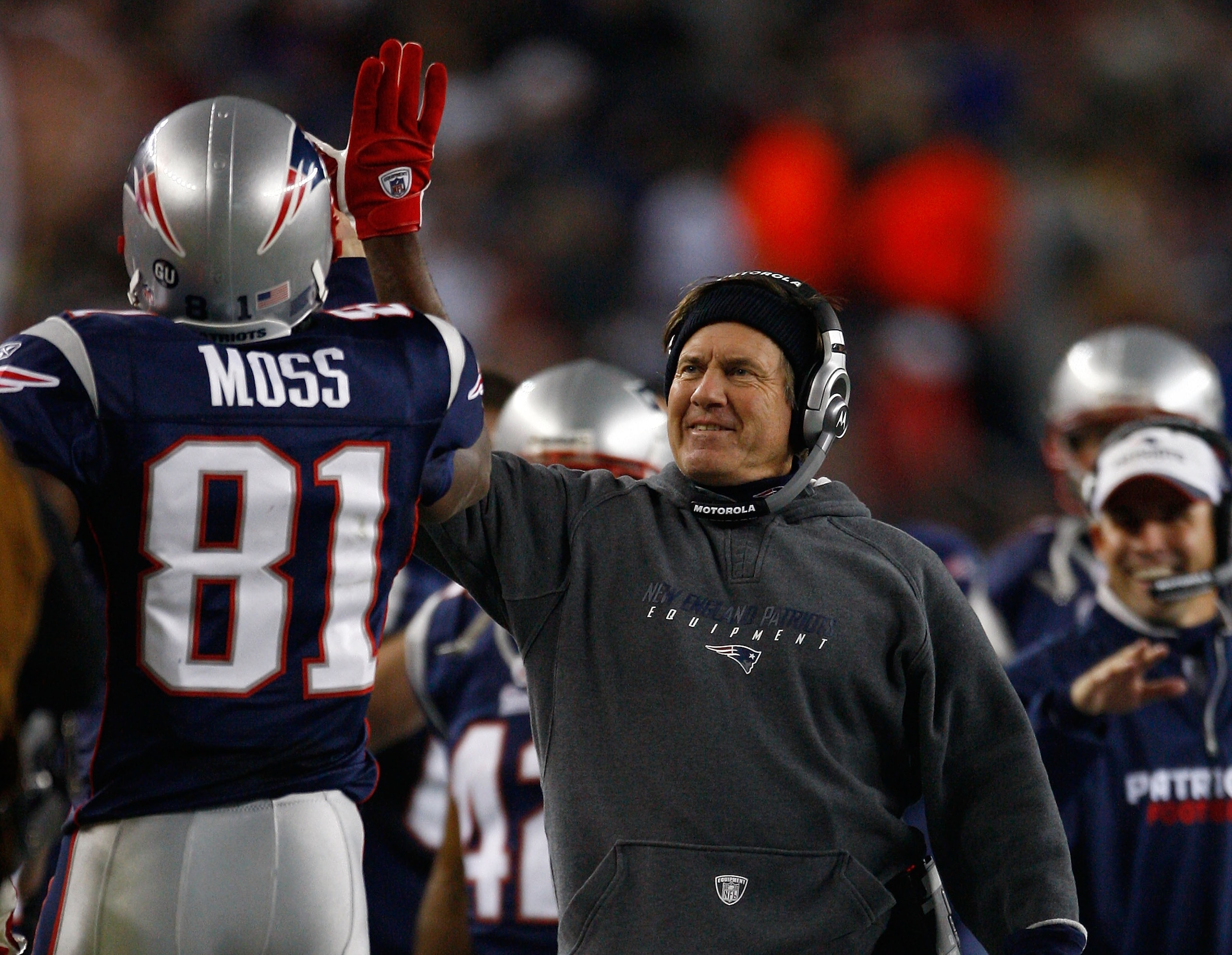 FOXBORO, MA - OCTOBER 20: Coach Bill Belichick celebrates after a second touchdown by Randy Moss #81 of the New England Patriots at Gillette Stadium on October 20, 2008 in Foxboro, Massachusetts. The Patriots won 41-7. (Photo by Jim Rogash/Getty Images) FOXBORO, MA - OCTOBER 20: Coach Bill Belichick celebrates after a second touchdown by Randy Moss #81 of the New England Patriots at Gillette Stadium on October 20, 2008 in Foxboro, Massachusetts. The Patriots won 41-7. (Photo by Jim Rogash/Getty Images)