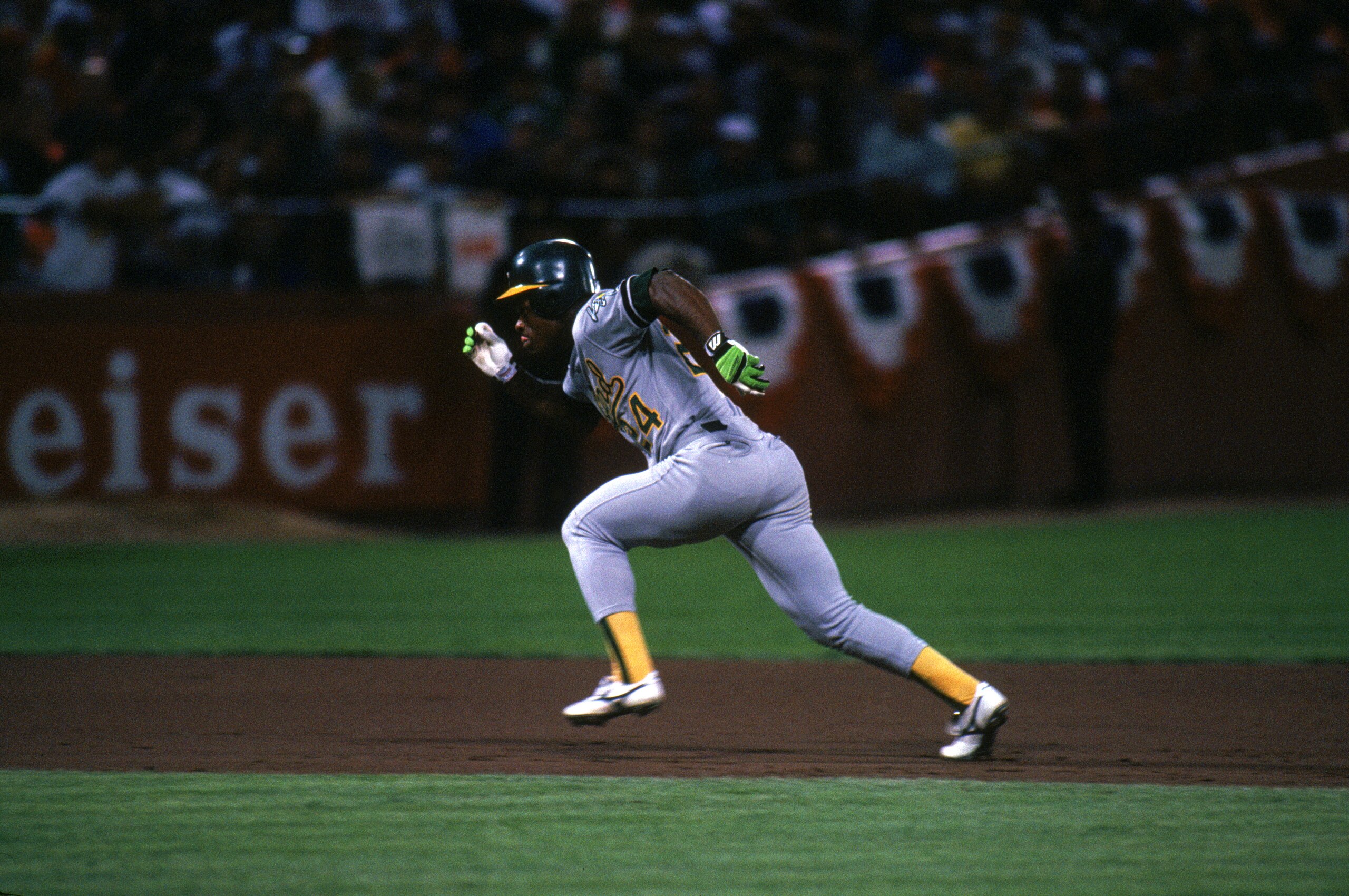 SAN FRANCISCO - OCTOBER:  Rickey Henderson #22 of the Oakland Athletics runs during the 1989 World Series against the San Francisco Gaints at Candlestick Park in San Francisco, California, in October. (Photo by Otto Greule Jr/Getty Images)