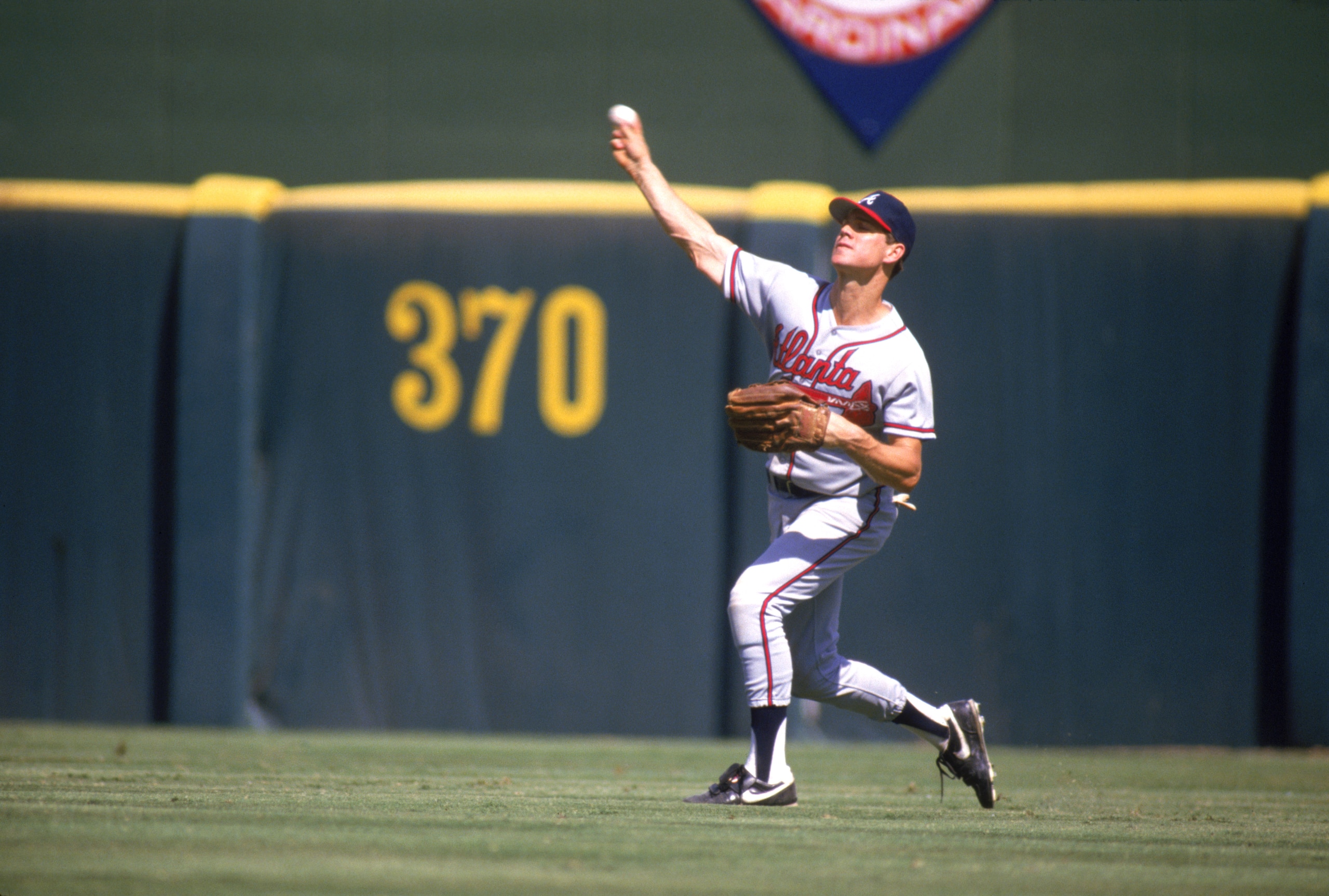 SAN DIEGO - 1987:  Dale Murphy #3 of the Atlanta Braves throws the ball to the infield during a game against the San Diego Padres in 1987 at Jack Murphy Stadium in San Diego, California.  (Photo by Stephen Dunn/Getty Images)