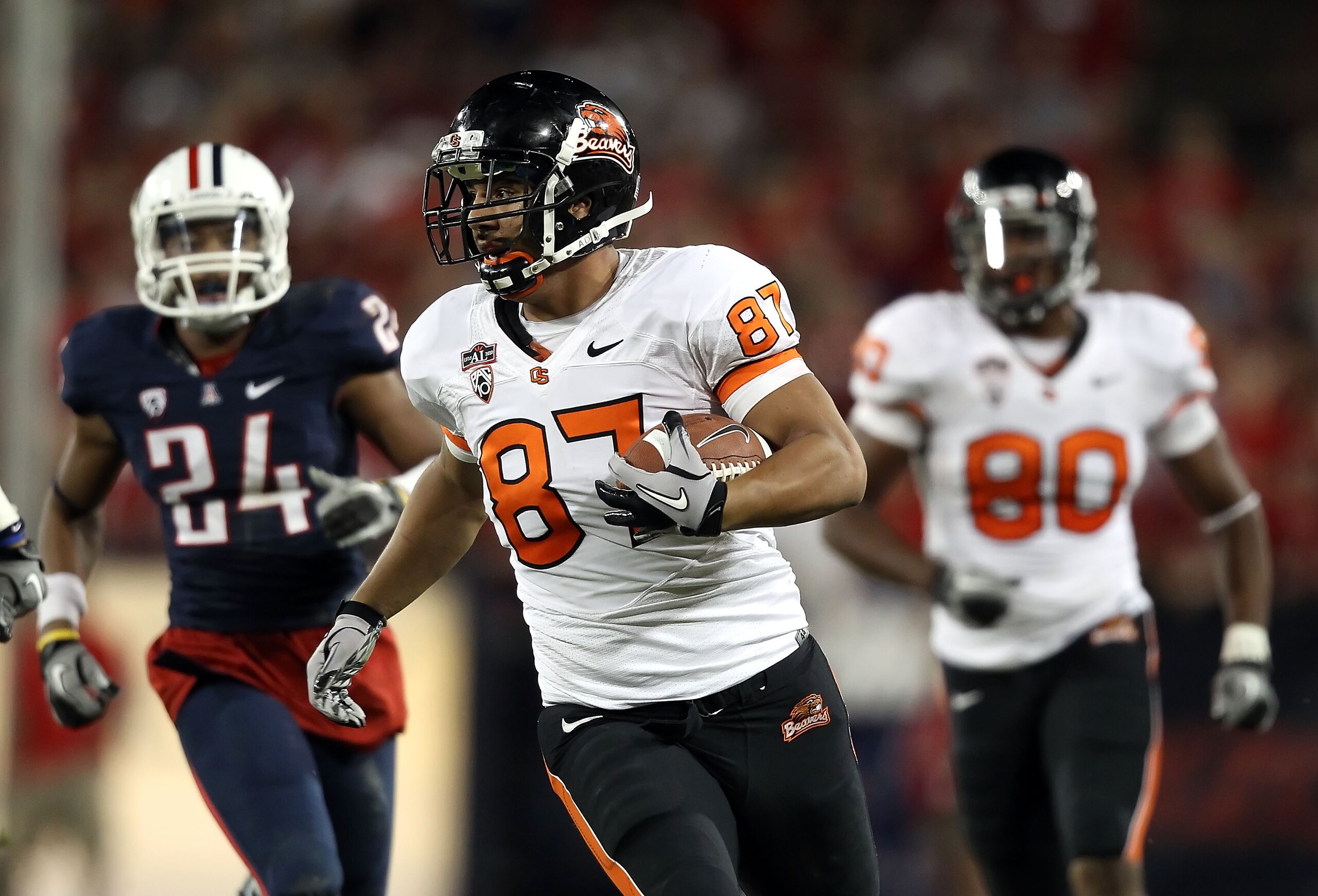 TUCSON, AZ - OCTOBER 09:  Tight end Joe Halahuni #87 of the Oregon State Beavers runs with the football after a 43 yard reception against the Arizona Wildcats during the fourth quarter of the college football game at Arizona Stadium on October 9, 2010 in
