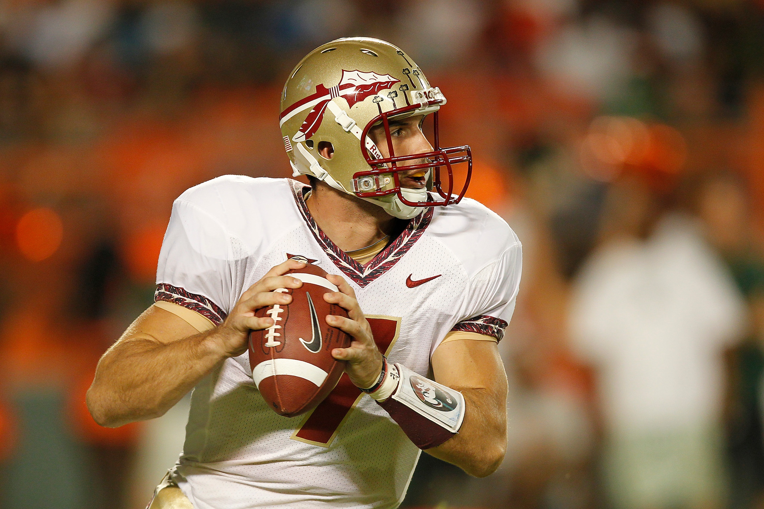 MIAMI, FL - OCTOBER 9: Christian Ponder #7 of the Florida State Seminoles runs out of the pocket to pass the ball against the Miami Hurricanes on October 9, 2010 at Sun Life Stadium in Miami, Florida. (Photo by Joel Auerbach/Getty Images)
