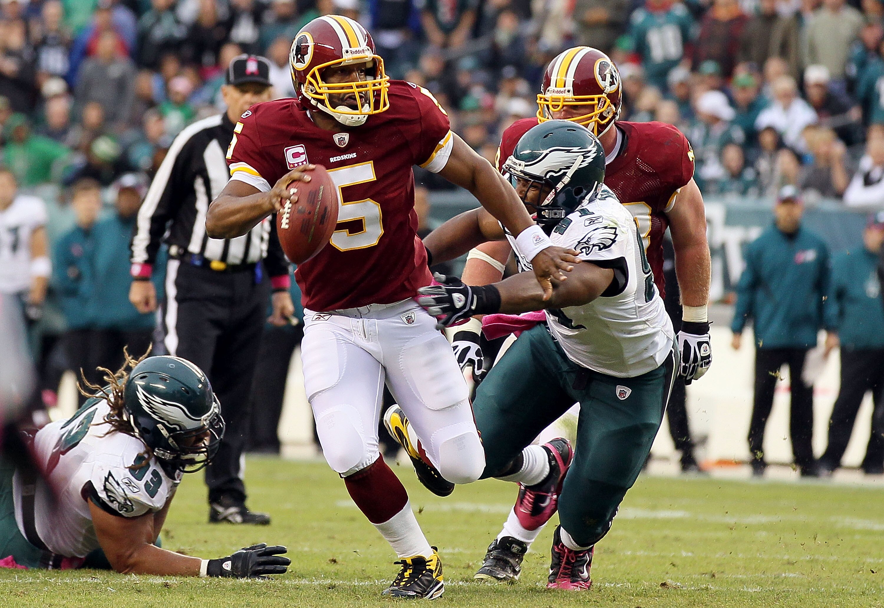 PHILADELPHIA - OCTOBER 03:  Donovan McNabb #5 of the Washington Redskins runs the ball against Darryl Tapp #91 of the Philadelphia Eagles  on October 3, 2010 at Lincoln Financial Field in Philadelphia, Pennsylvania.  (Photo by Jim McIsaac/Getty Images)