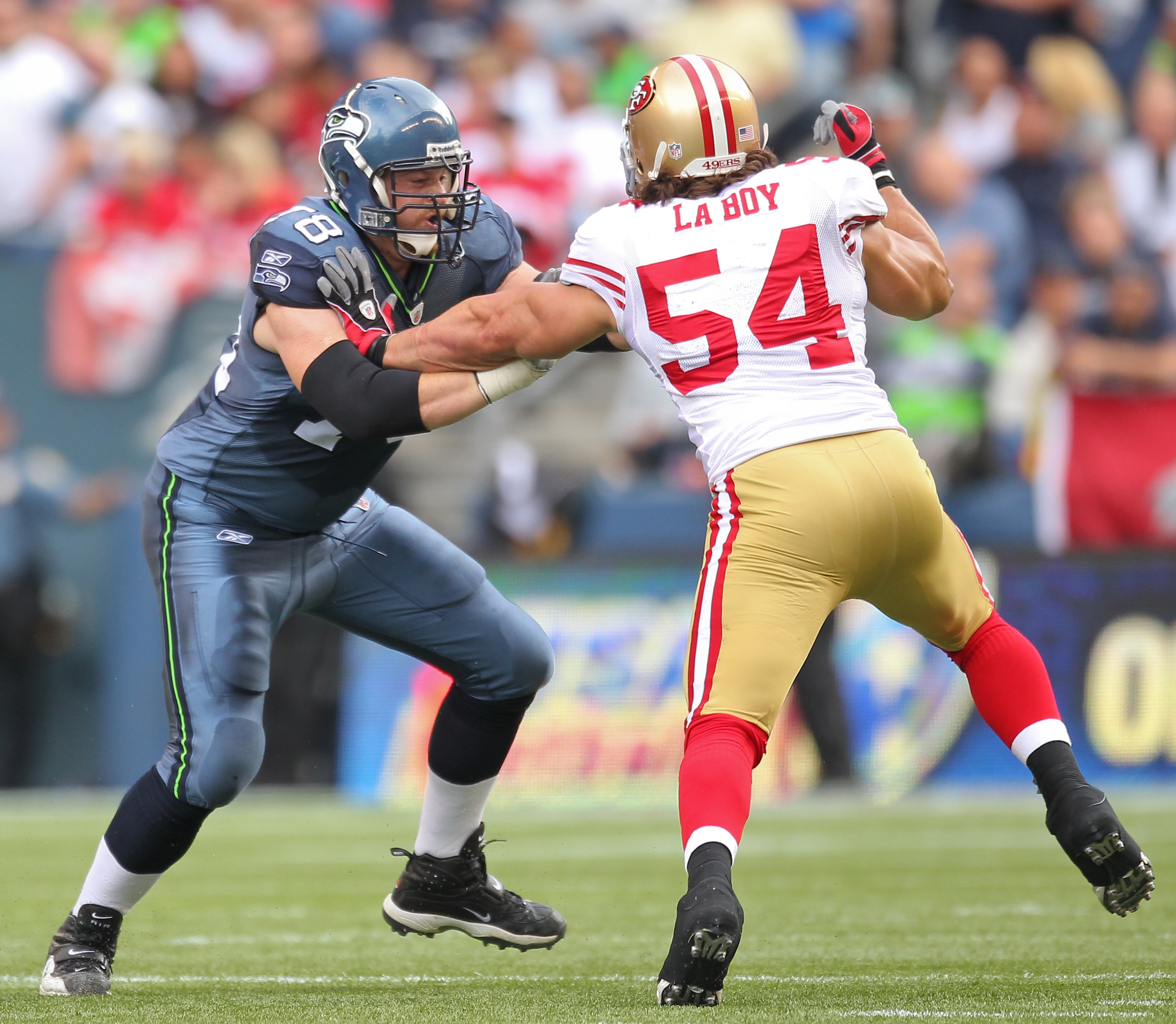 SEATTLE - SEPTEMBER 12:  Tackle Tyler Polumbus #78 of the Seattle Seahawks pass blocks against Travis LaBoy #54 of the San Francisco 49ers during the NFL season opener at Qwest Field on September 12, 2010 in Seattle, Washington. (Photo by Otto Greule Jr/G