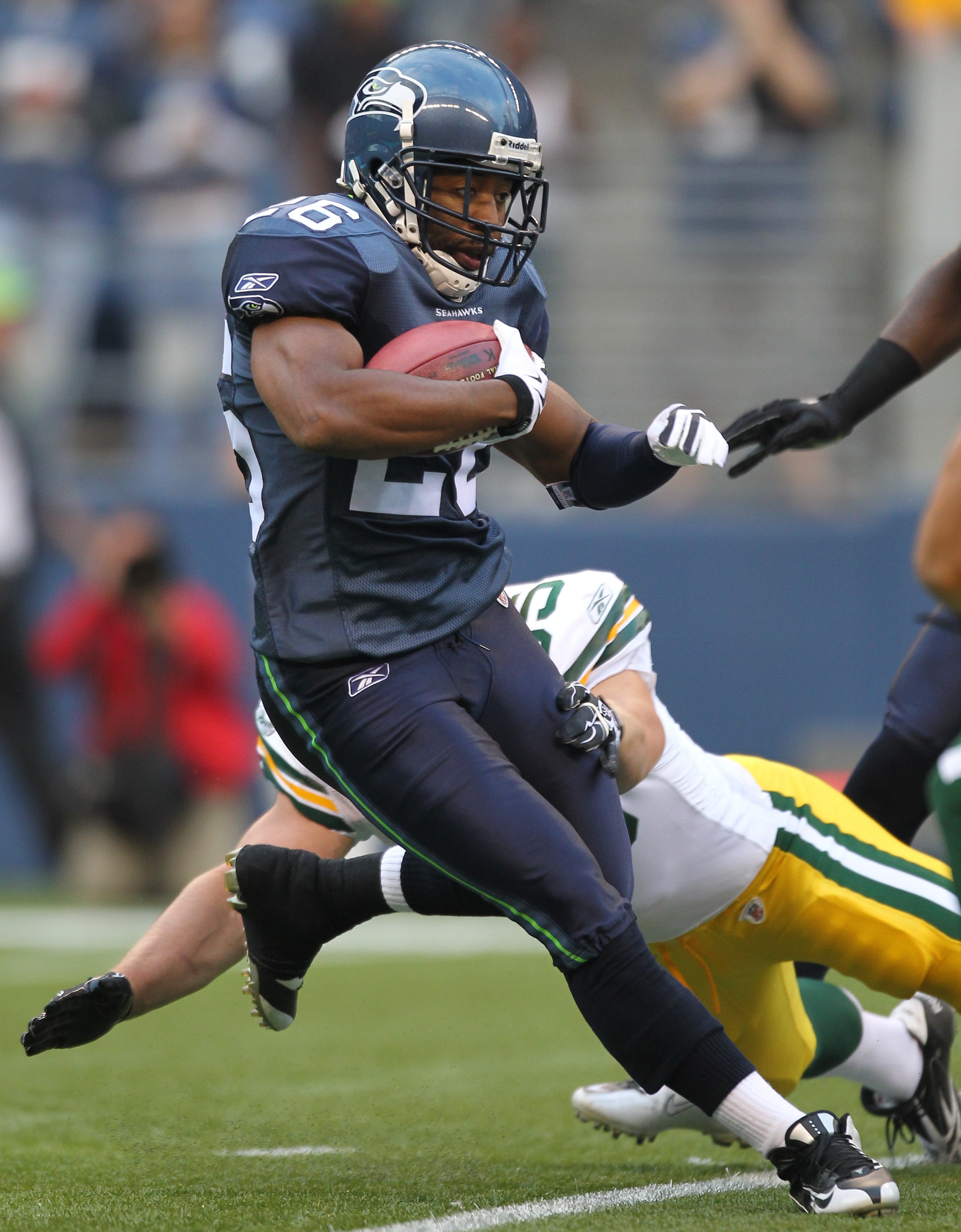 SEATTLE - AUGUST 21:  Josh Wilson #26 of the Seattle Seahawks returns a kick during the preseason game against the Green Bay Packers at Qwest Field on August 21, 2010 in Seattle, Washington. (Photo by Otto Greule Jr/Getty Images)