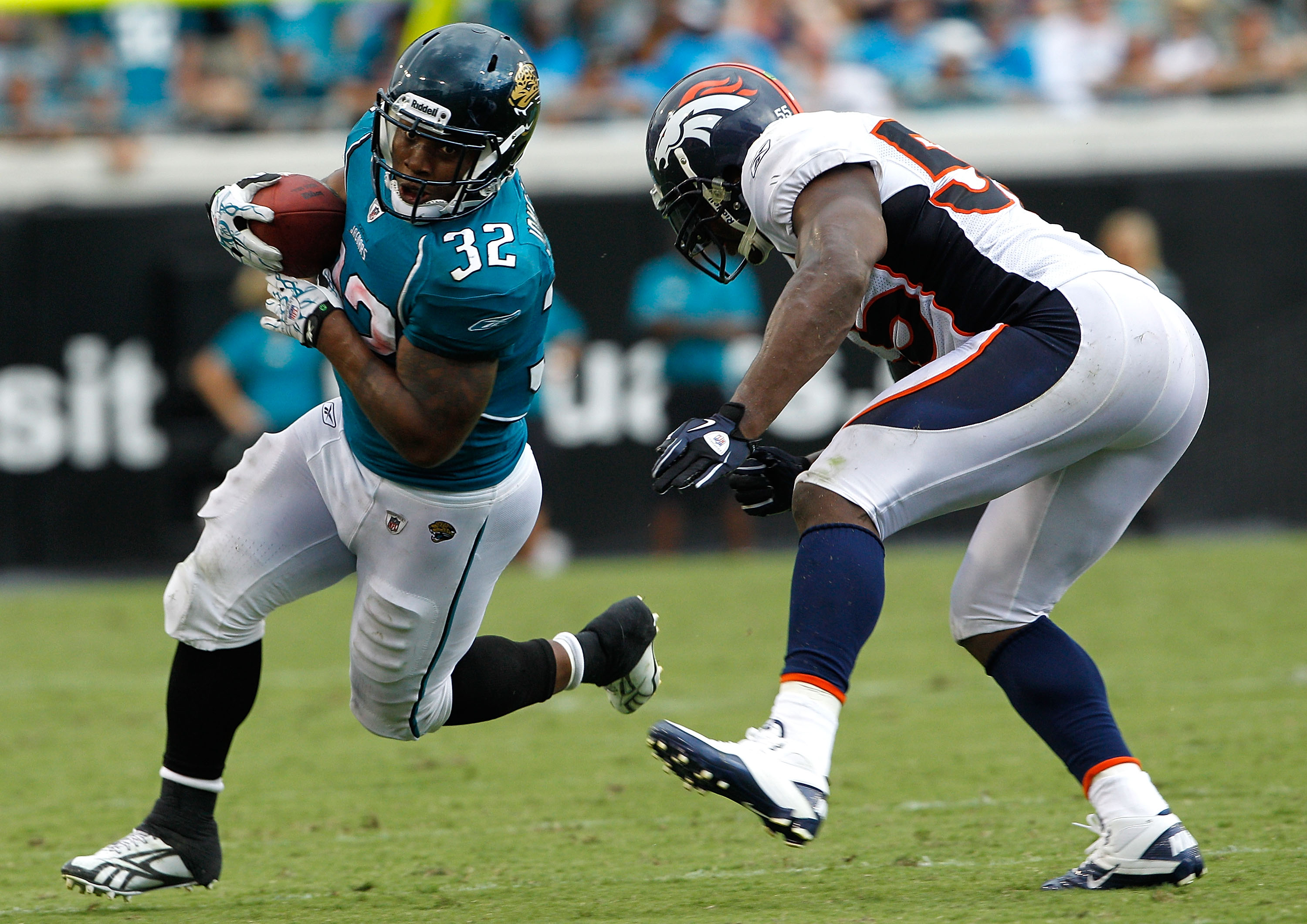 JACKSONVILLE, FL - SEPTEMBER 12:  D.J. Williams #55 of the Denver Broncos attempts to tackle Maurice Jones-Drew #32 of the Jacksonville Jaguars during the NFL season opener game at EverBank Field on September 12, 2010 in Jacksonville, Florida.  (Photo by