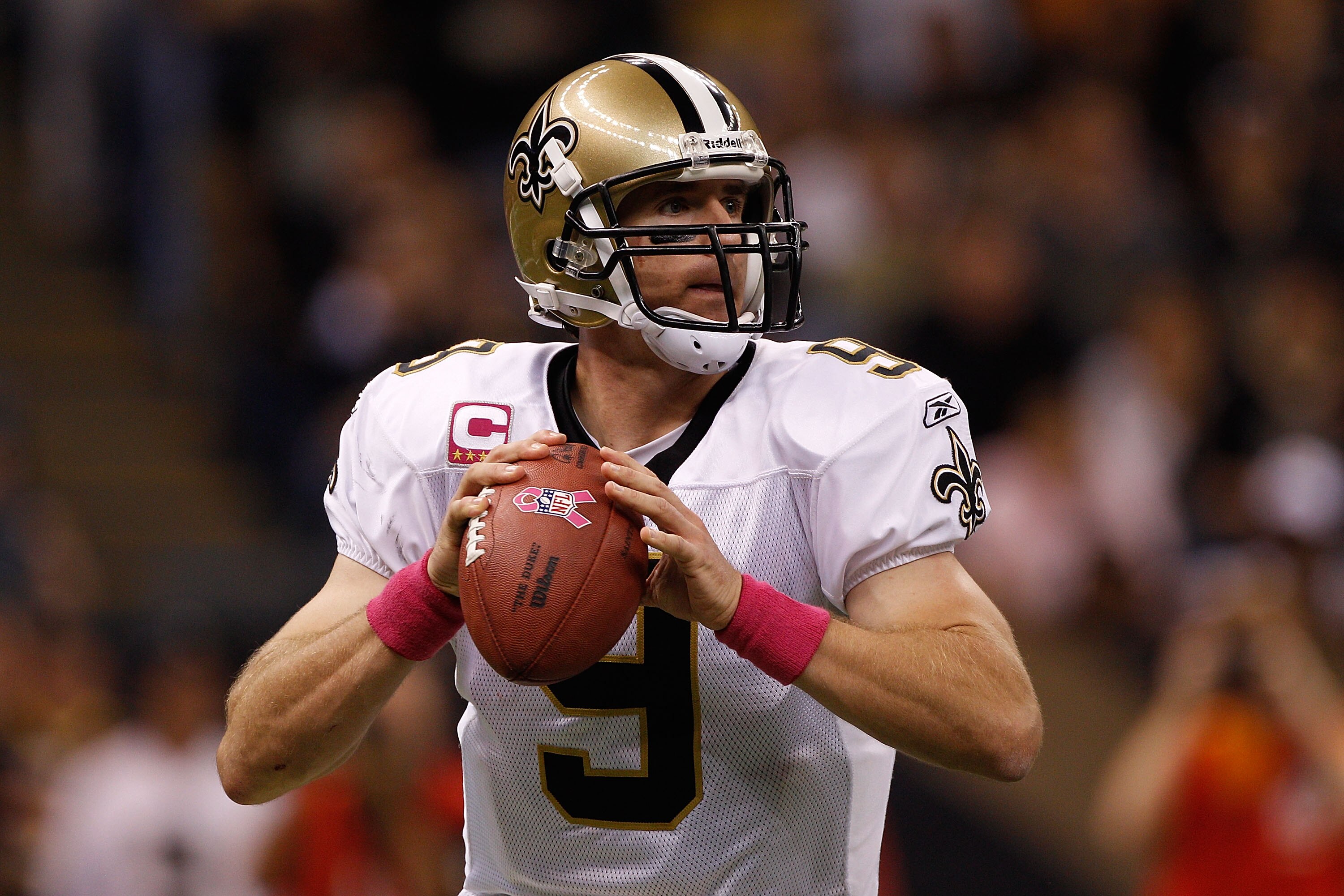 NEW ORLEANS - OCTOBER 03:  Drew Brees #9 of the New Orleans Saints looks to throw a pass against the Carolina Panthers at the Louisiana Superdome on October 3, 2010 in New Orleans, Louisiana.  (Photo by Chris Graythen/Getty Images)