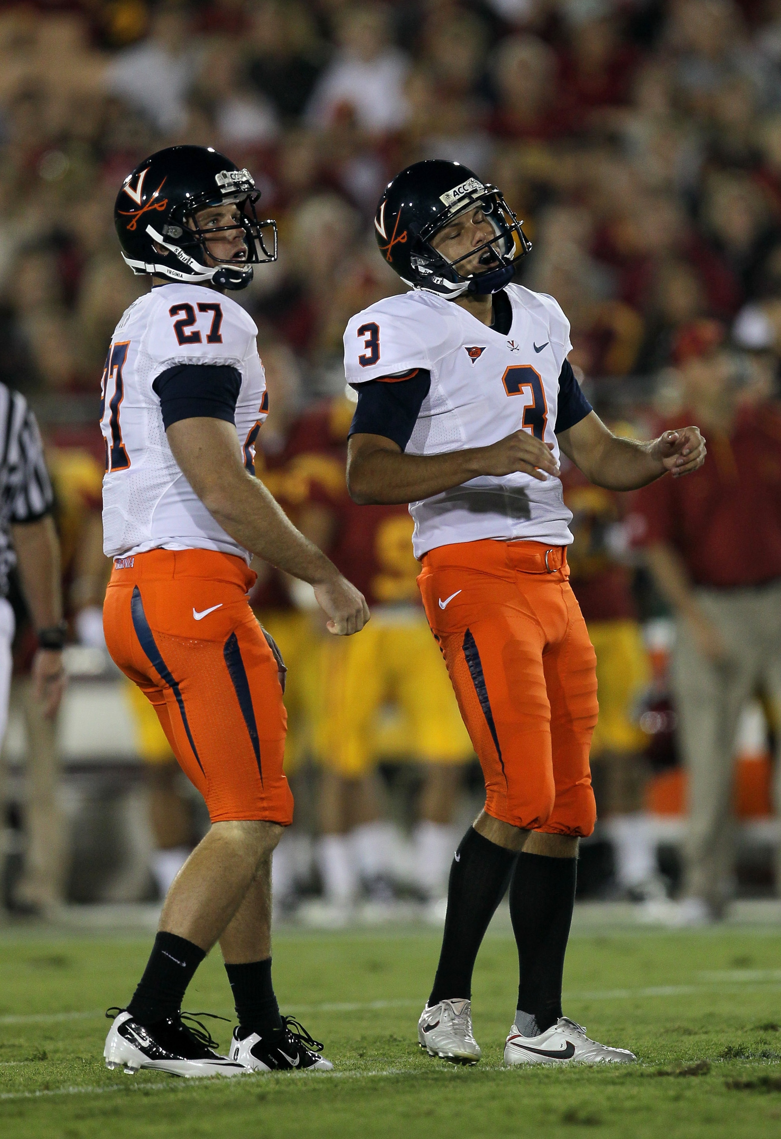 LOS ANGELES - SEPTEMBER 11:  Place kicker Robert Randolph #3 and holdler Jacob Hodges #27 of the Virginia Cavaliers react after missing a field goal attempt in the first quarter against the USC Trojans at Los Angeles Memorial Coliseum on September 11, 201