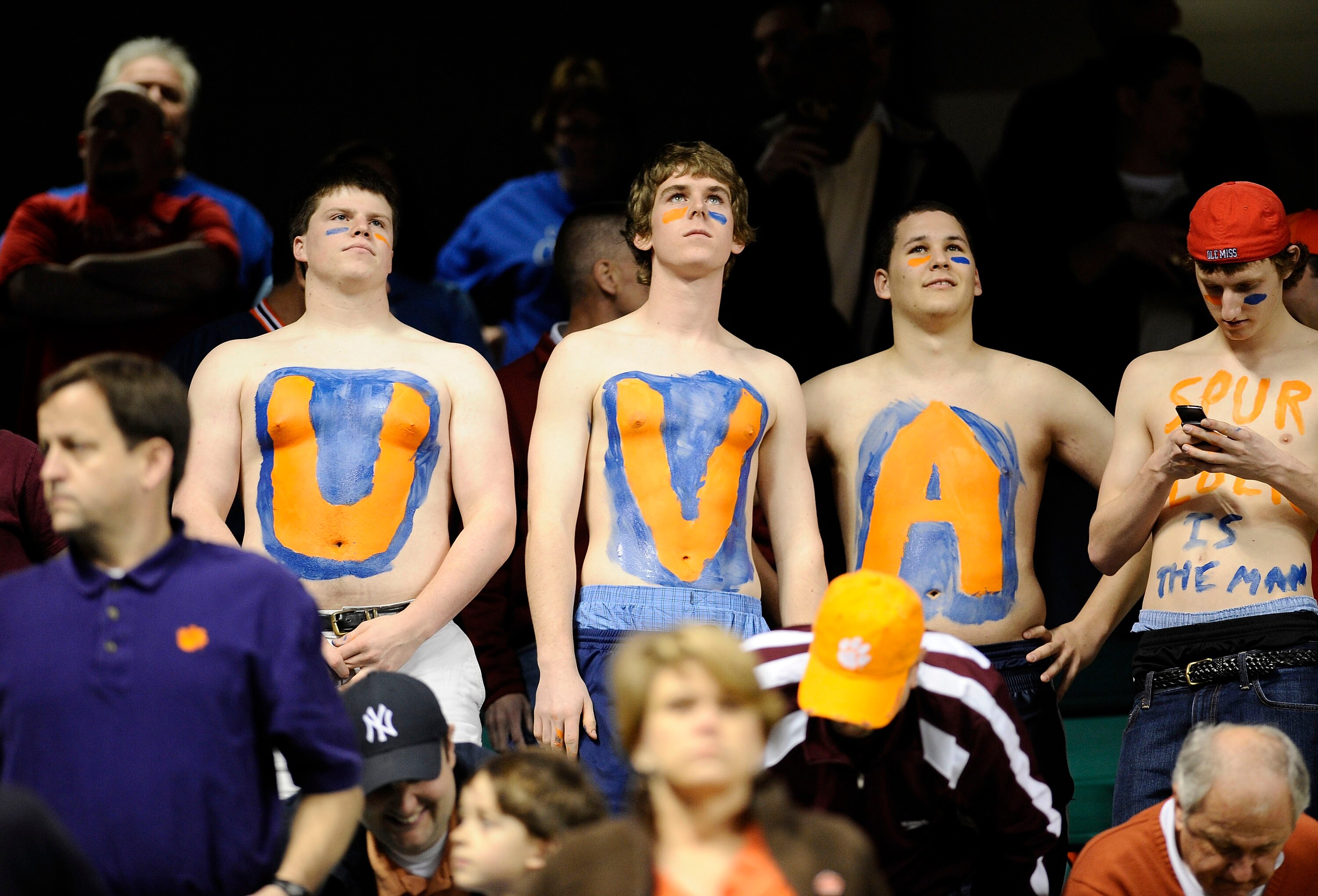 GREENSBORO, NC - MARCH 12:  Fans of the University of Virginia Cavaliers watch the game against the Duke Blue Devils in their quarterfinal game in the 2010 ACC Men's Basketball Tournament at the Greensboro Coliseum on March 12, 2010 in Greensboro, North C