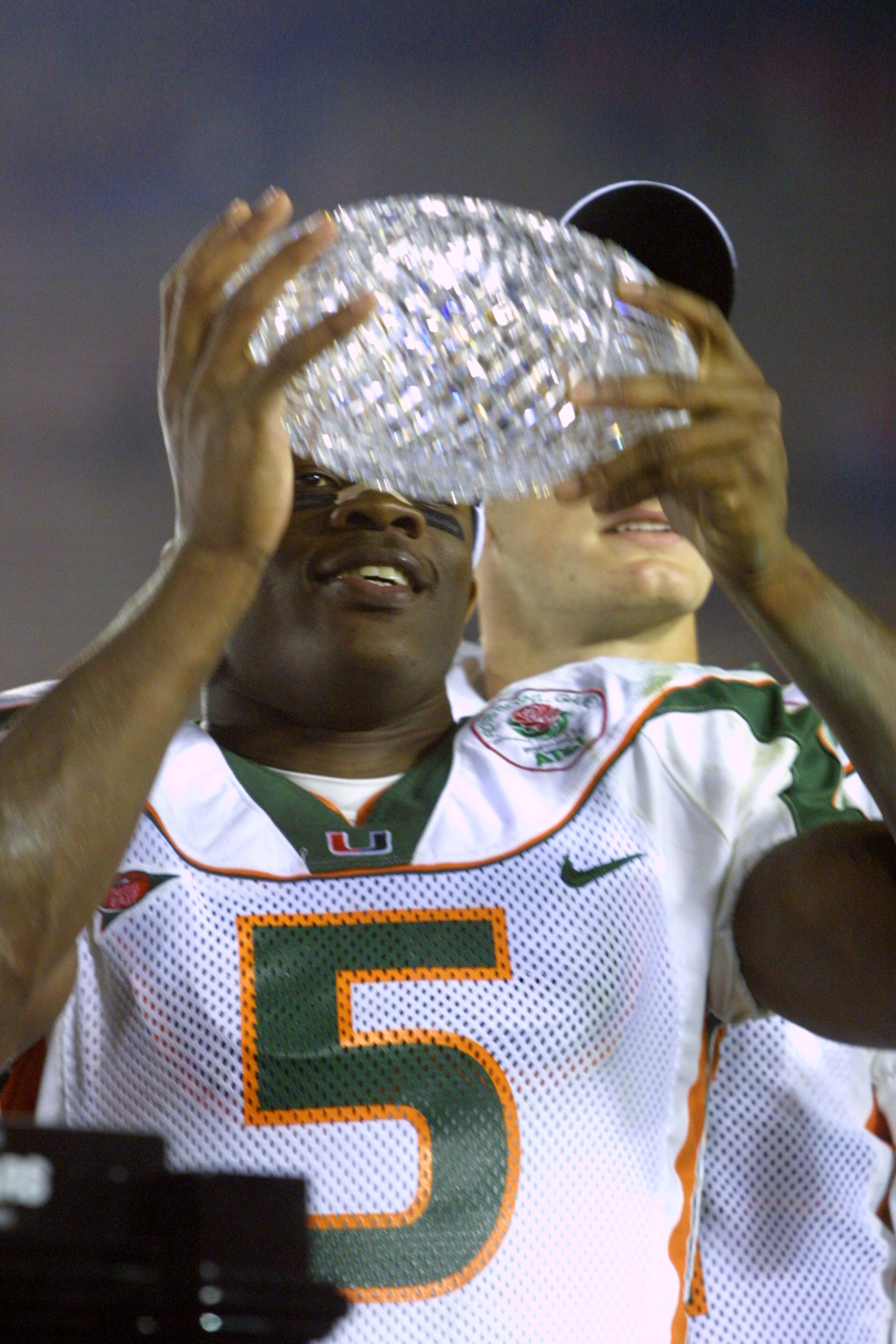 3 Jan 2002: University of Miami running back Andre Johnson #5 holds the Sears National Championship trophy on the victory podium after the Rose Bowl National Championship Game versus Nebraska at the Rose Bowl in Pasadena, California. Miami won 37-14. 3 Jan 2002: University of Miami running back Andre Johnson #5 holds the Sears National Championship trophy on the victory podium after the Rose Bowl National Championship Game versus Nebraska at the Rose Bowl in Pasadena, California. Miami won 37-14.
