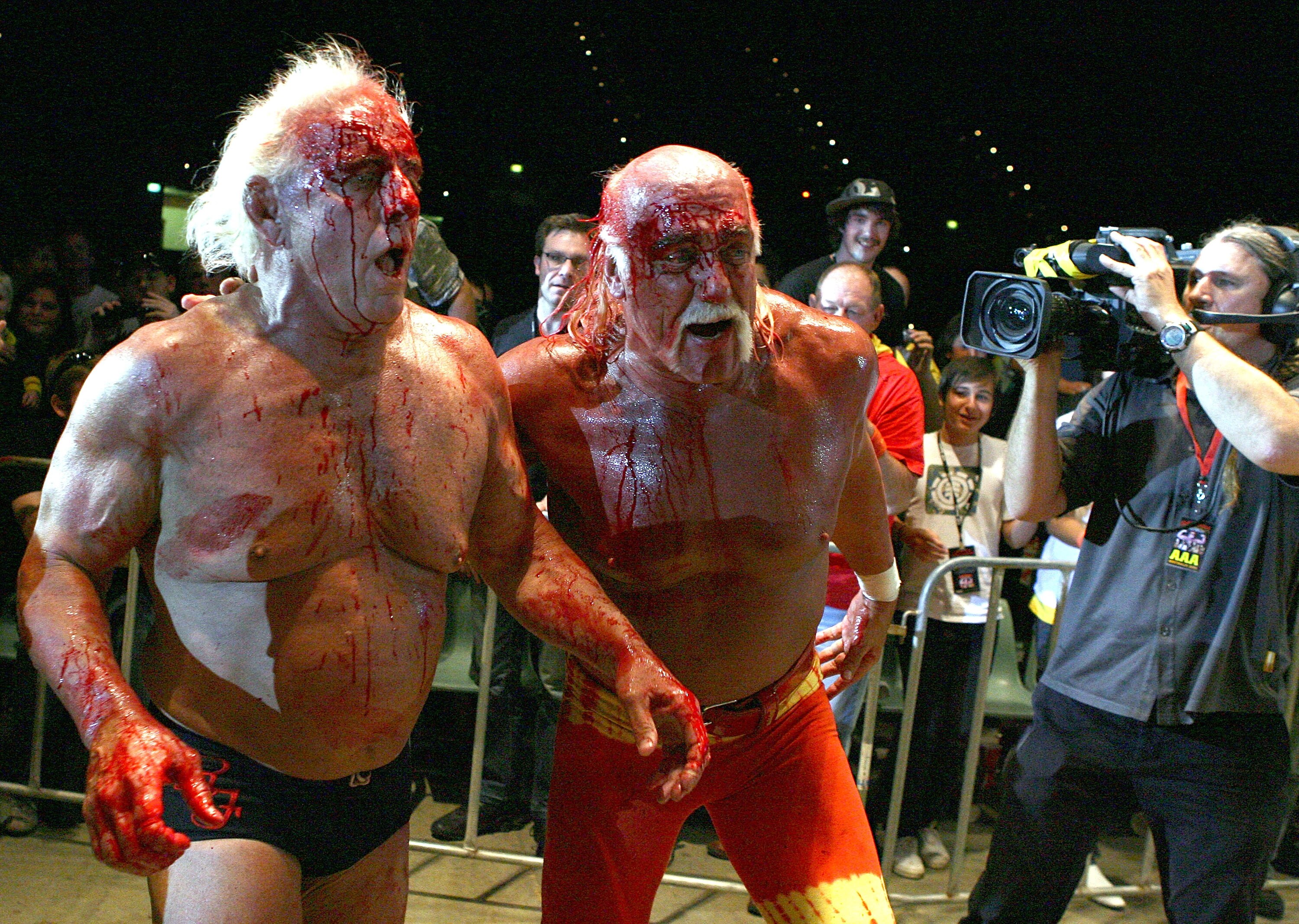 PERTH, AUSTRALIA - NOVEMBER 24:  Hulk Hogan guides Rick Flair back to the ring during the Hulkamania Tour at the Burswood Dome on November 24, 2009 in Perth, Australia.  (Photo by Paul Kane/Getty Images)