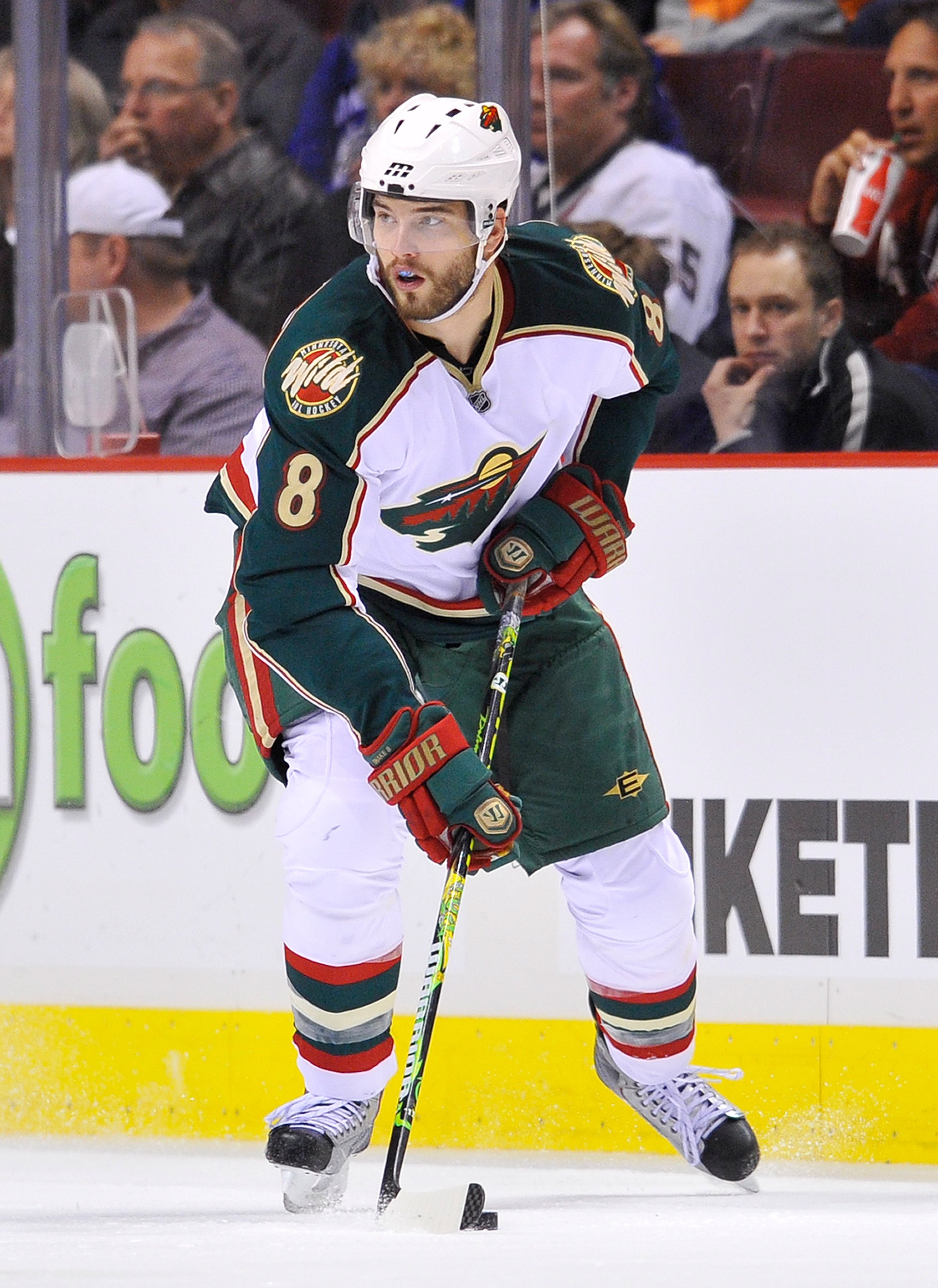 VANCOUVER, CANADA - APRIL 4:  Brent Burns #8 of the Minnesota Wild skates with the puck up ice during the NHL game against the Vancouver Canucks on April 04, 2010 at General Motors Place in Vancouver, British Columbia, Canada.  (Photo by Rich Lam/Getty Im