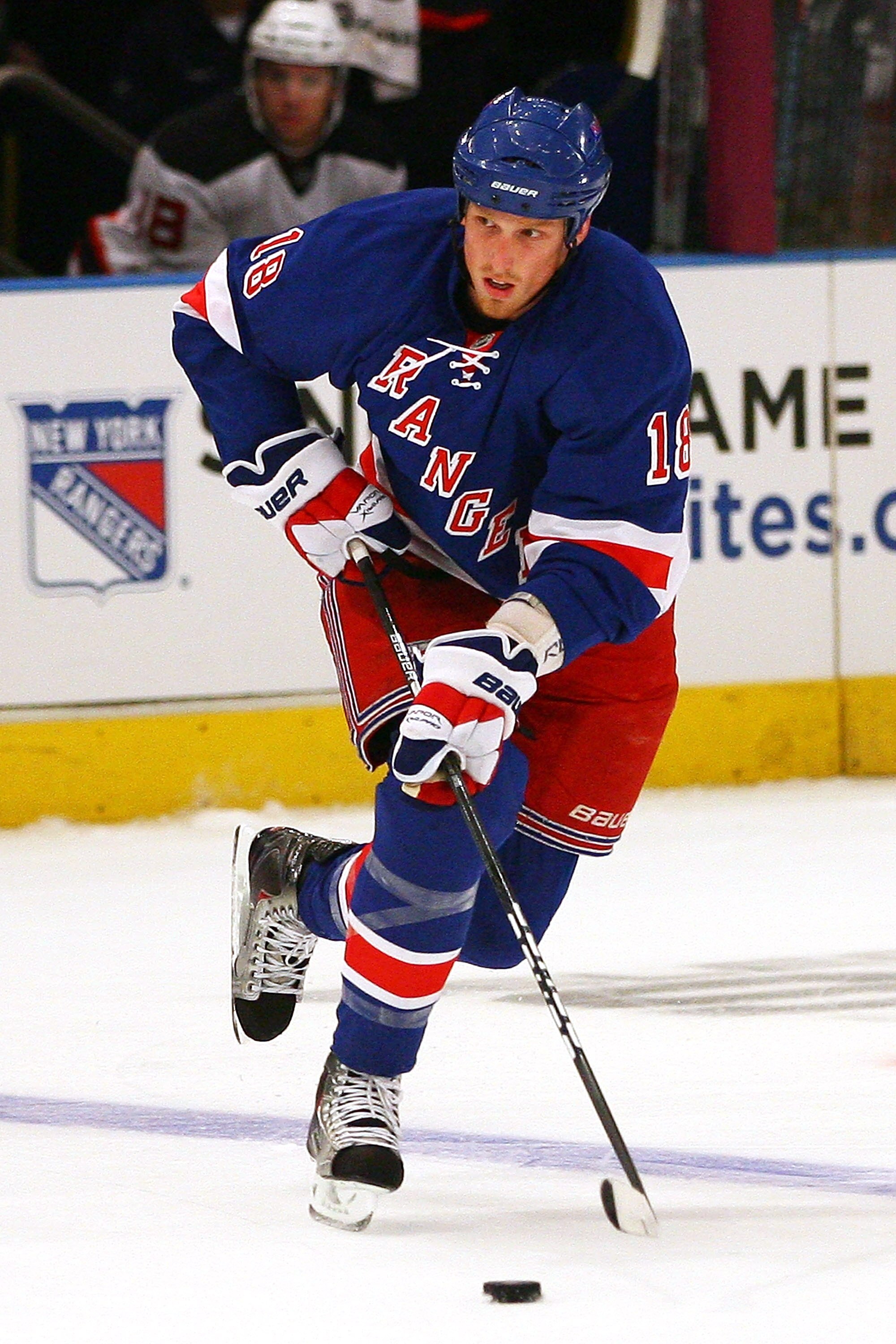 NEW YORK - SEPTEMBER 23:  Marc Staal #18 of the New York Rangers skates with the puck during a preseason game against the New Jersey Devils at Madison Square Garden on September 23, 2010 in New York City.  (Photo by Andrew Burton/Getty Images)