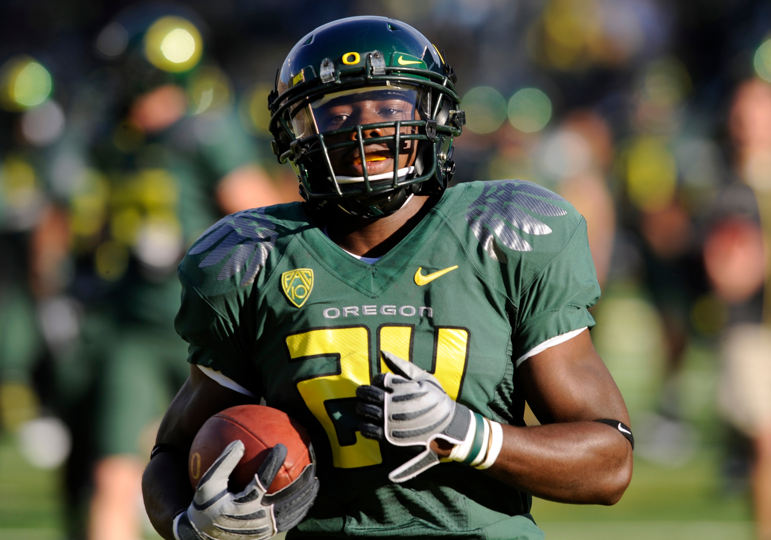 EUGENE, OR - OCTOBER 2: Running back Kenjon Barner #24 of the Oregon Ducks runs with the ball during warmups before the game against the Stanford Cardinal at Autzen Stadium on October 2, 2010 in Eugene, Oregon. Oregon won the game 52-31. (Photo by Steve D