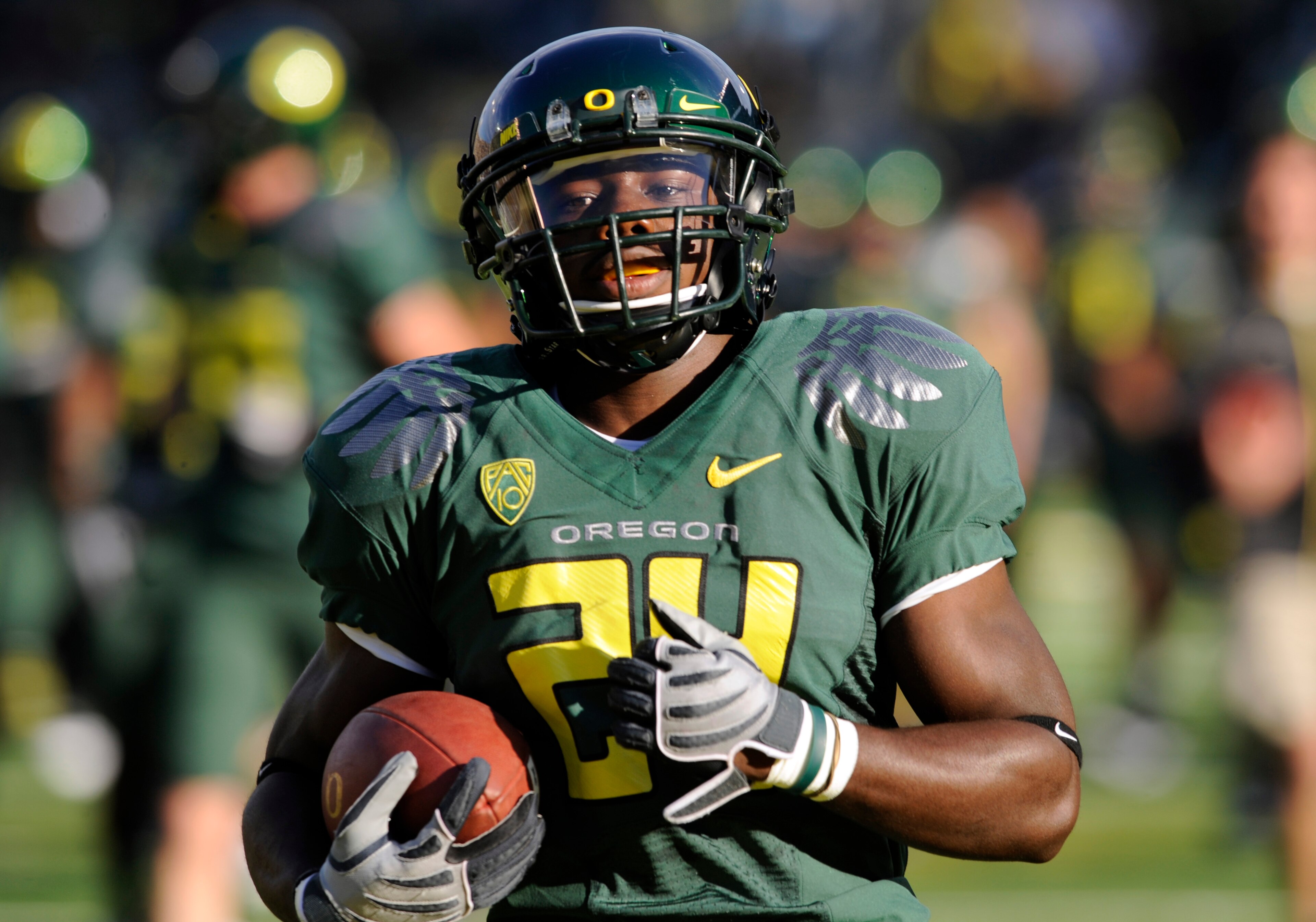 EUGENE, OR - OCTOBER 2: Running back Kenjon Barner #24 of the Oregon Ducks runs with the ball during warmups before the game against the Stanford Cardinal at Autzen Stadium on October 2, 2010 in Eugene, Oregon. Oregon won the game 52-31. (Photo by Steve D