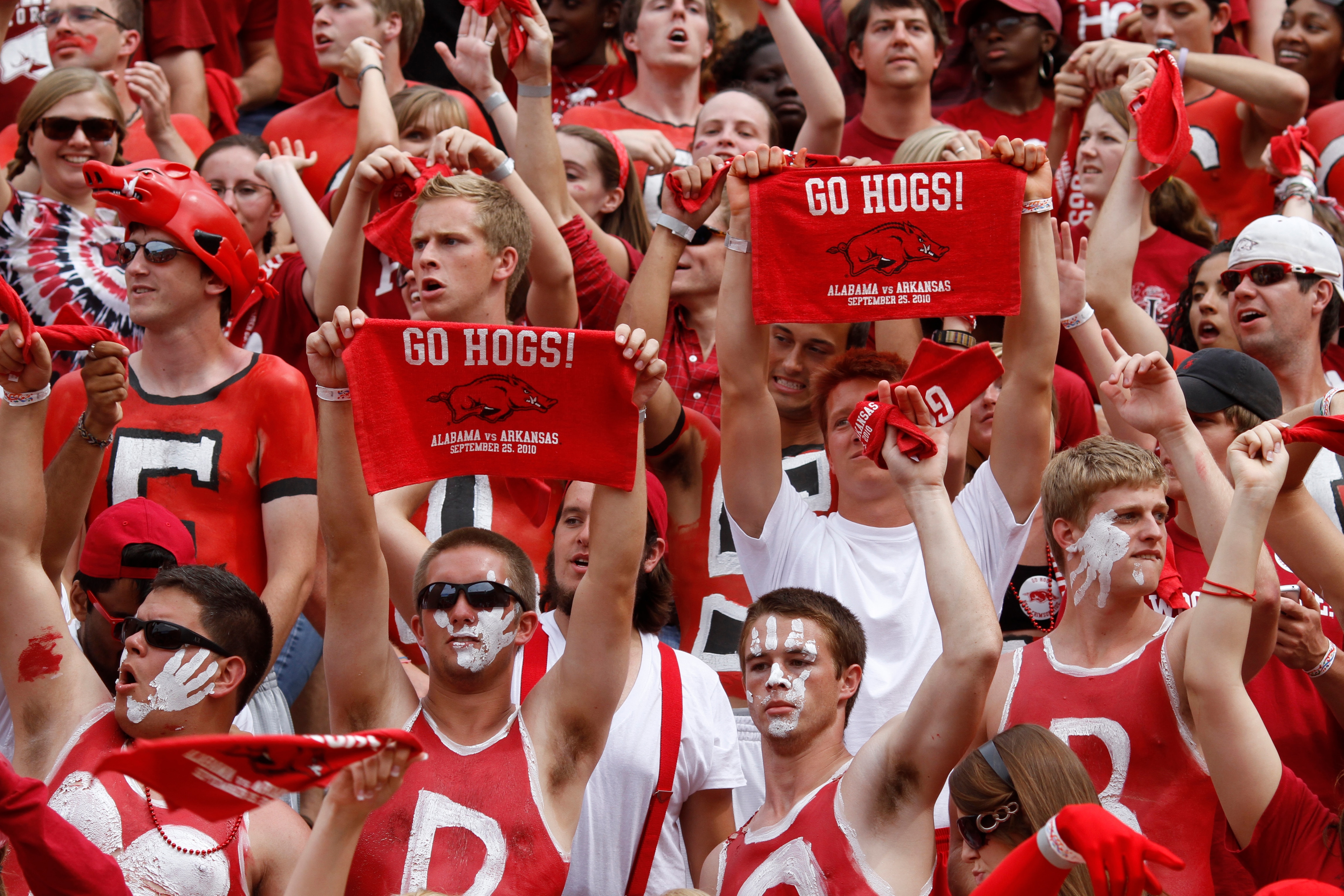 FAYETTEVILLE - SEPTEMBER 25: Arkansas Razorbacks fans cheer during the game against the Alabama Crimson Tide at Donald W. Reynolds Razorback Stadium on September 25, 2010 in Fayetteville, Arkansas. Alabama won 24-20. (Photo by Joe Robbins/Getty Images)
