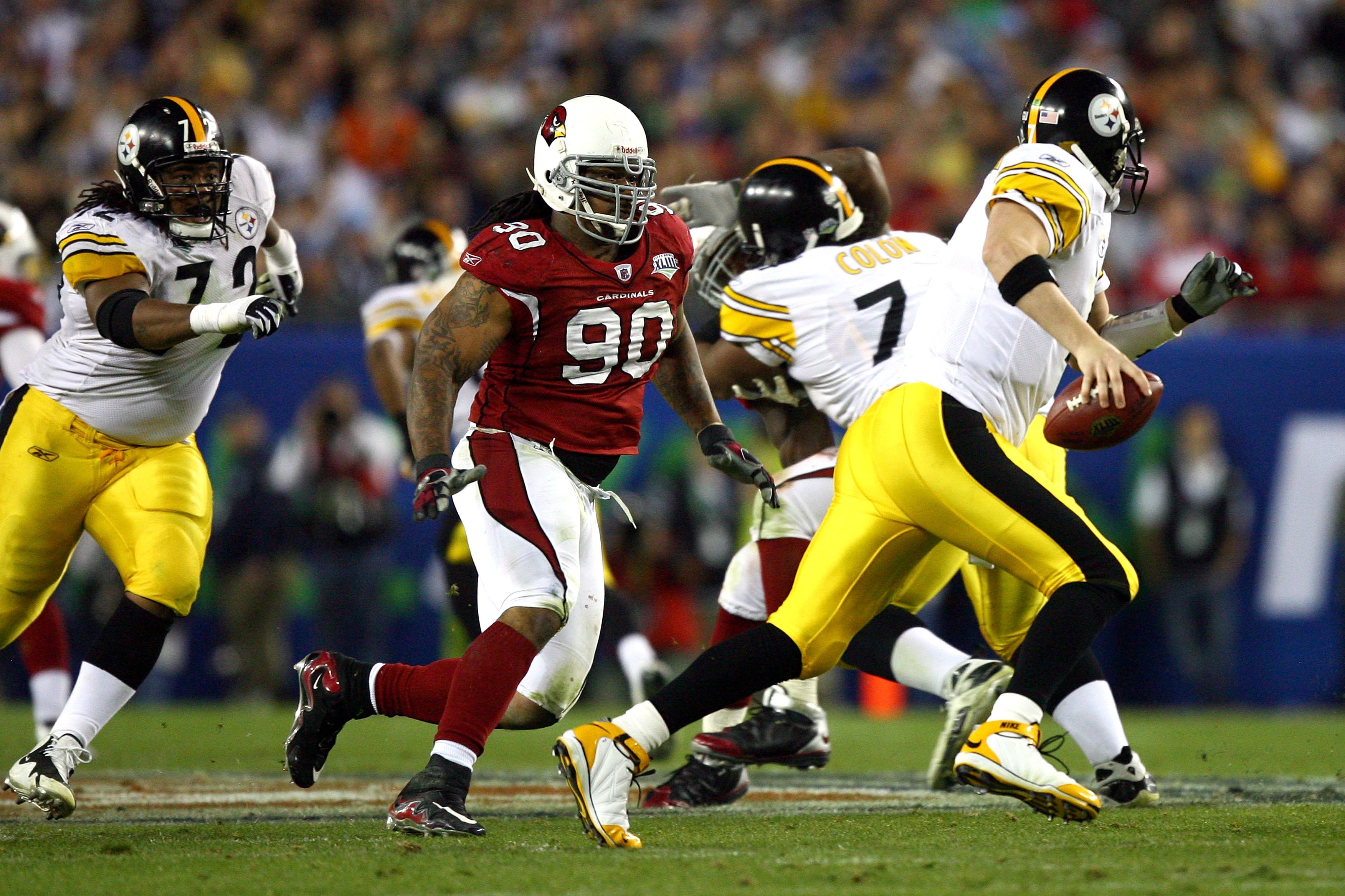 TAMPA, FL - FEBRUARY 01:  Darnell Dockett #90 of the Arizona Cardinals pressures quarterback Ben Roethlisberger #7 of the Pittsburgh Steelers past the block of Darnell Stapleton #72 during Super Bowl XLIII on February 1, 2009 at Raymond James Stadium in T