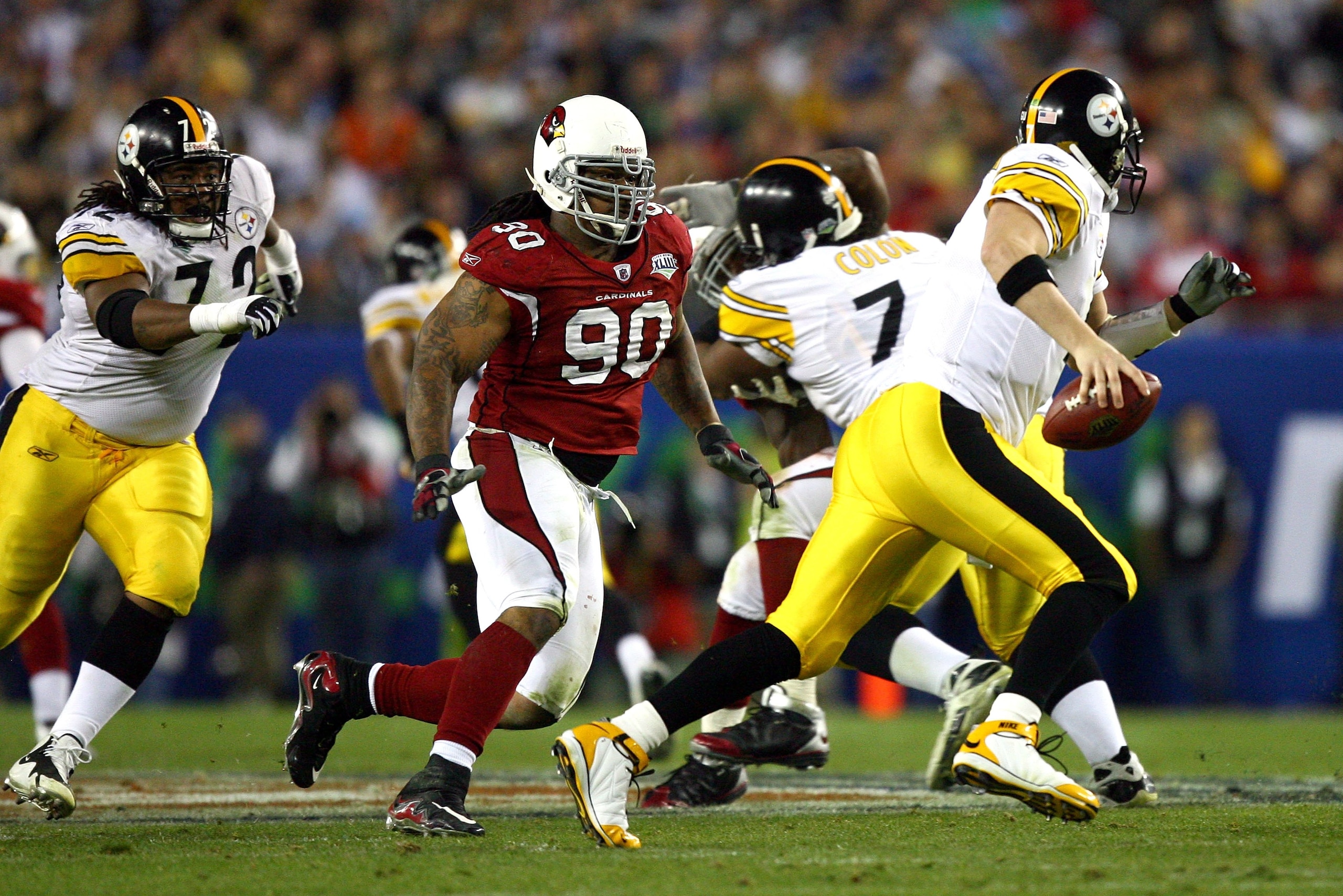 TAMPA, FL - FEBRUARY 01: Darnell Dockett #90 of the Arizona Cardinals pressures quarterback Ben Roethlisberger #7 of the Pittsburgh Steelers past the block of Darnell Stapleton #72 during Super Bowl XLIII on February 1, 2009 at Raymond James Stadium in T TAMPA, FL - FEBRUARY 01: Darnell Dockett #90 of the Arizona Cardinals pressures quarterback Ben Roethlisberger #7 of the Pittsburgh Steelers past the block of Darnell Stapleton #72 during Super Bowl XLIII on February 1, 2009 at Raymond James Stadium in T