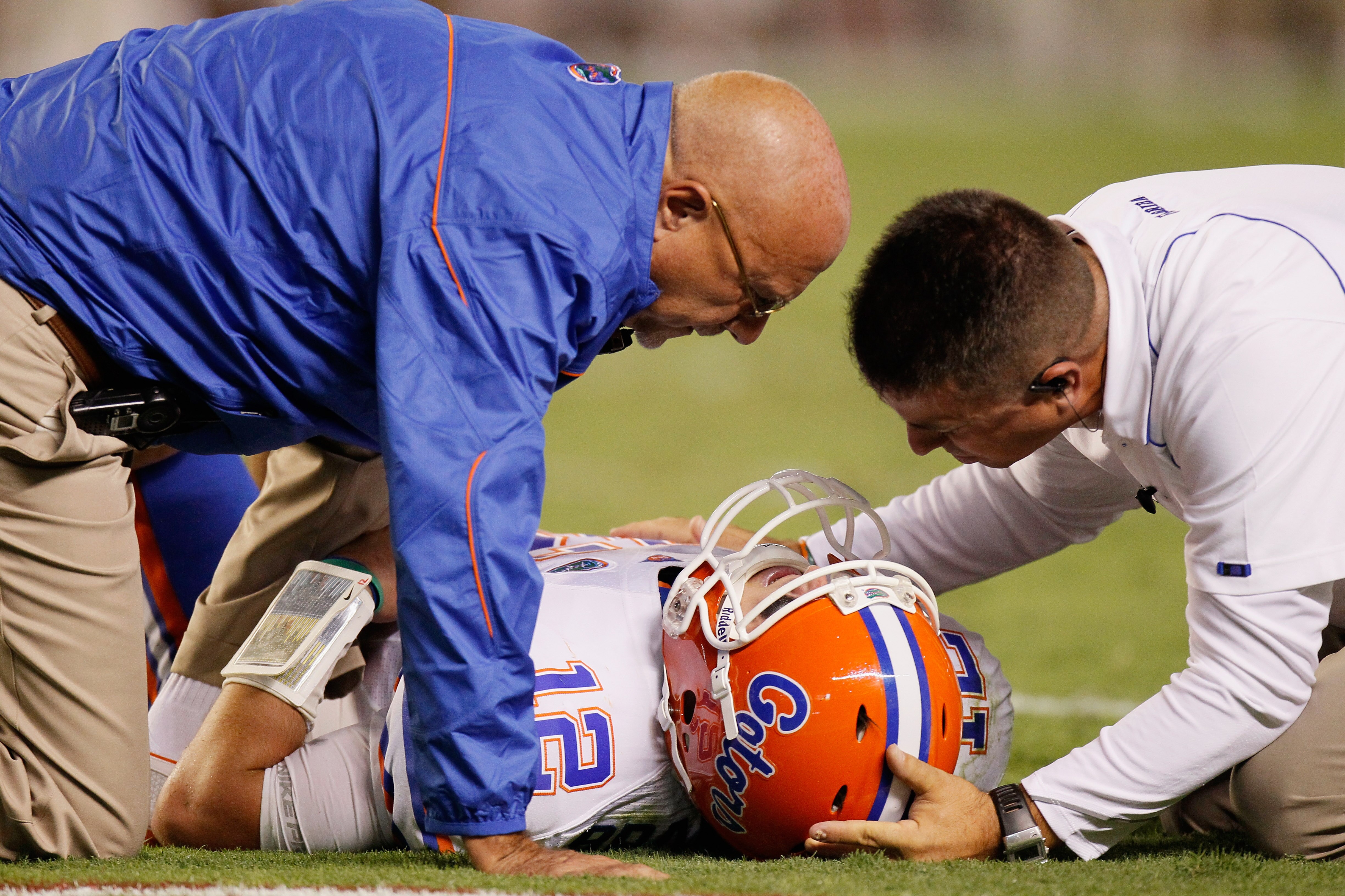 TUSCALOOSA, AL - OCTOBER 02:  Quarterback John Brantley #12 of the Florida Gators is attended to by trainers against the Alabama Crimson Tide at Bryant-Denny Stadium on October 2, 2010 in Tuscaloosa, Alabama.  (Photo by Kevin C. Cox/Getty Images)