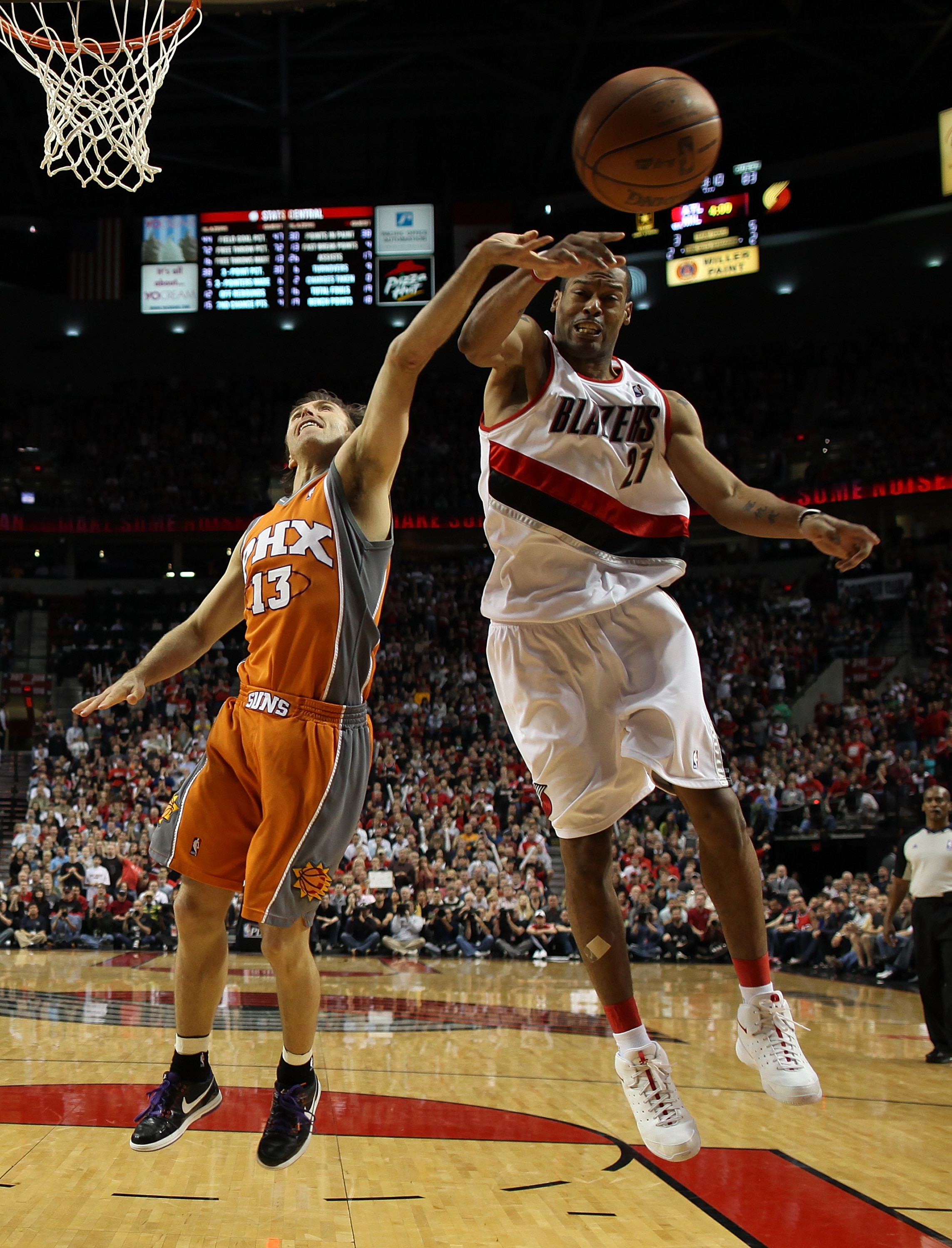 PORTLAND, OR - APRIL 24:  Steve Nash #13 of the Phoenix Suns battles Marcus Camby #21 of the Portland Trail Blazers during Game 4 of the Western Conference Quarterfinals of the NBA Playoffs on April 24, 2010 at the Rose Garden in Portland, Oregon. The Bla