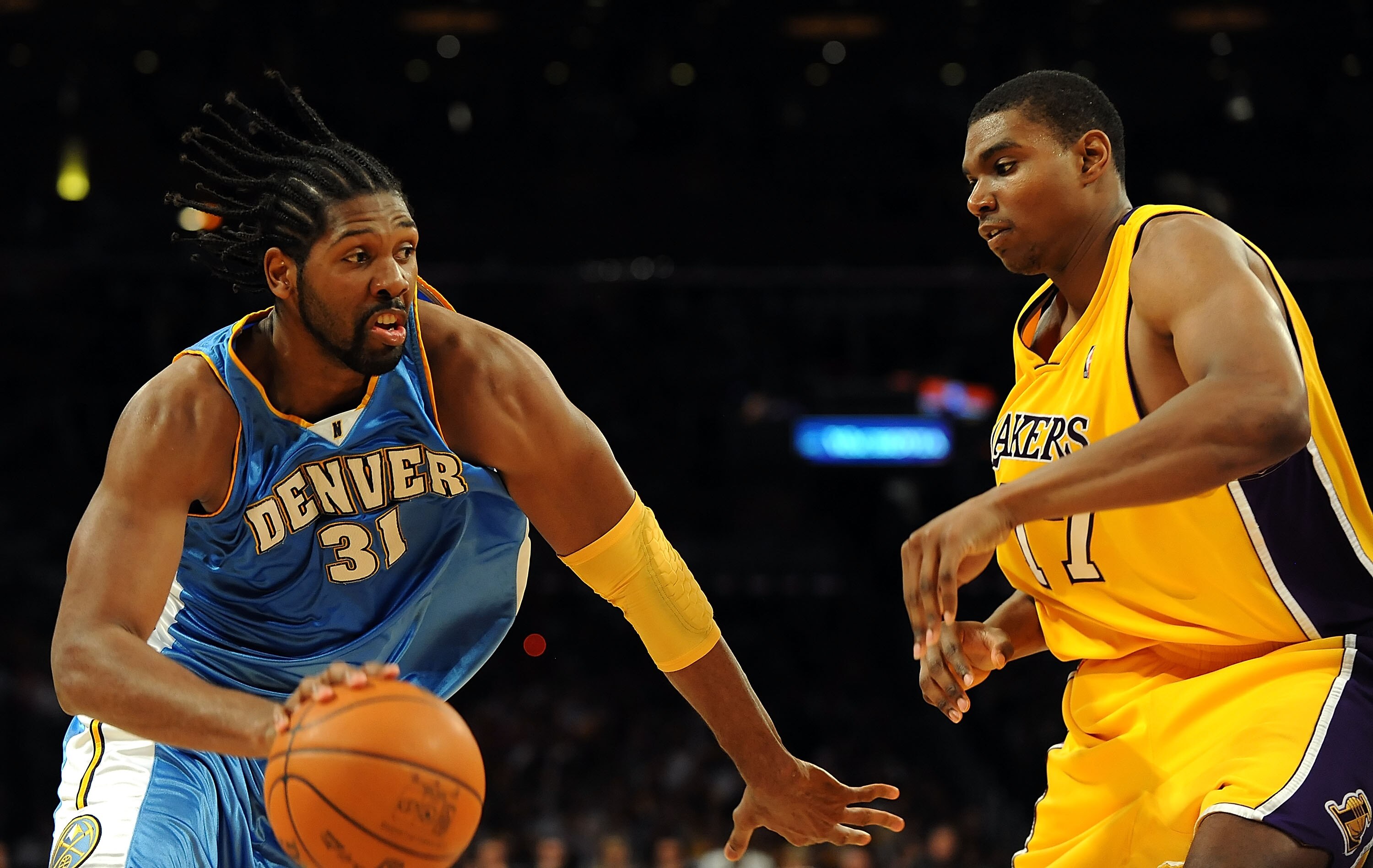 LOS ANGELES, CA - MAY 27:  Nene #31 of the Denver Nuggets drives on Andrew Bynum #17 of the Los Angeles Lakers in the second quarter of Game Five of the Western Conference Finals during the 2009 NBA Playoffs at Staples Center on May 27, 2009 in Los Angele