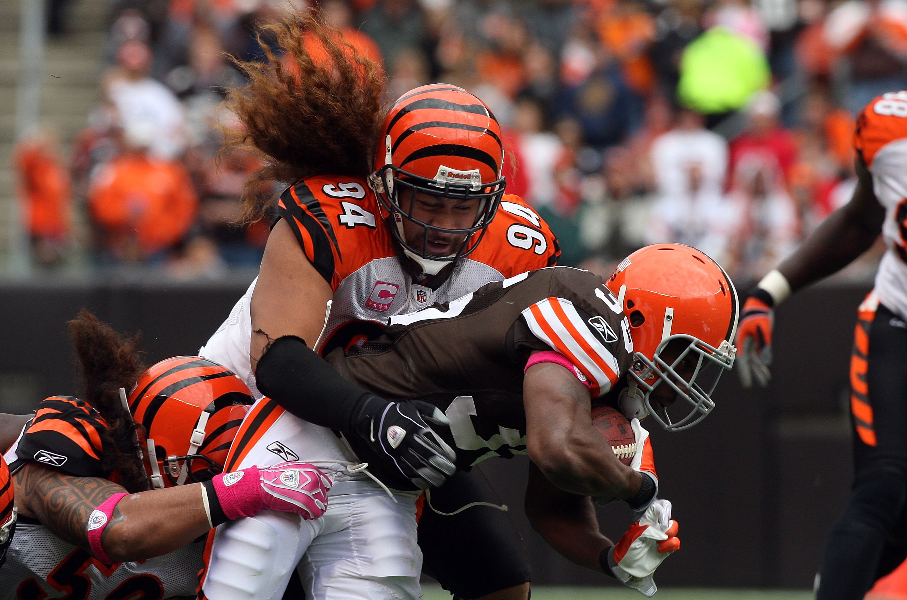 CLEVELAND - OCTOBER 04:  Jerome Harrison #35 of the Cleveland Browns is tackled by Domata Peko #94 of the Cincinnati Bengals during their game at Cleveland Browns Stadium on October 4, 2009 in Cleveland, Ohio. The Bengals defeated the Browns 23-20 in over