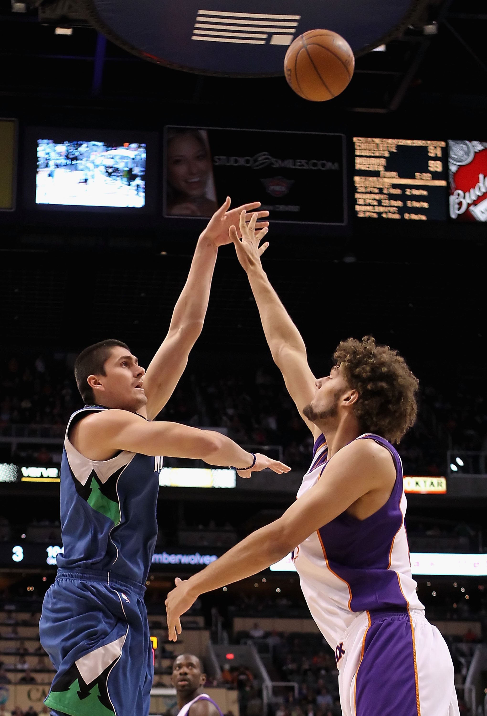 PHOENIX - MARCH 16:  Darko Milicic #31 of the Minnesota Timberwolves puts up a shot over Robin Lopez #15 of the Phoenix Suns during the NBA game at US Airways Center on March 16, 2010 in Phoenix, Arizona. The Suns defeated the Timberwolves 152-114.  NOTE