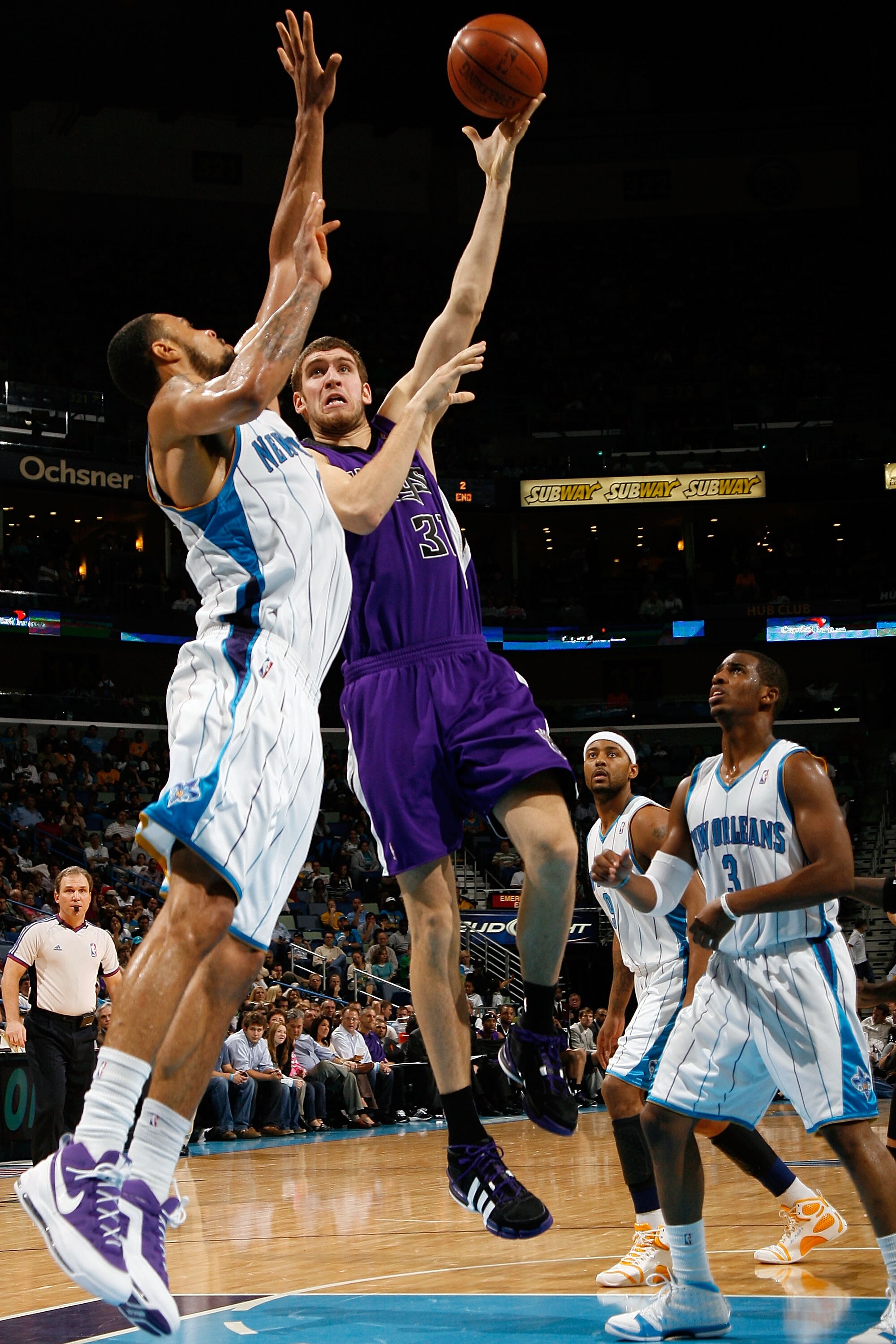 NEW ORLEANS - DECEMBER 20:  Spencer Hawes #31 of the Sacramento Kings makes a shot over Tyson Chandler #6 of the New Orleans Hornets on December 20, 2008 in New Orleans, Louisiana.   The Hornets defeated the Kings 99-90.   NOTE TO USER: User expressly ack