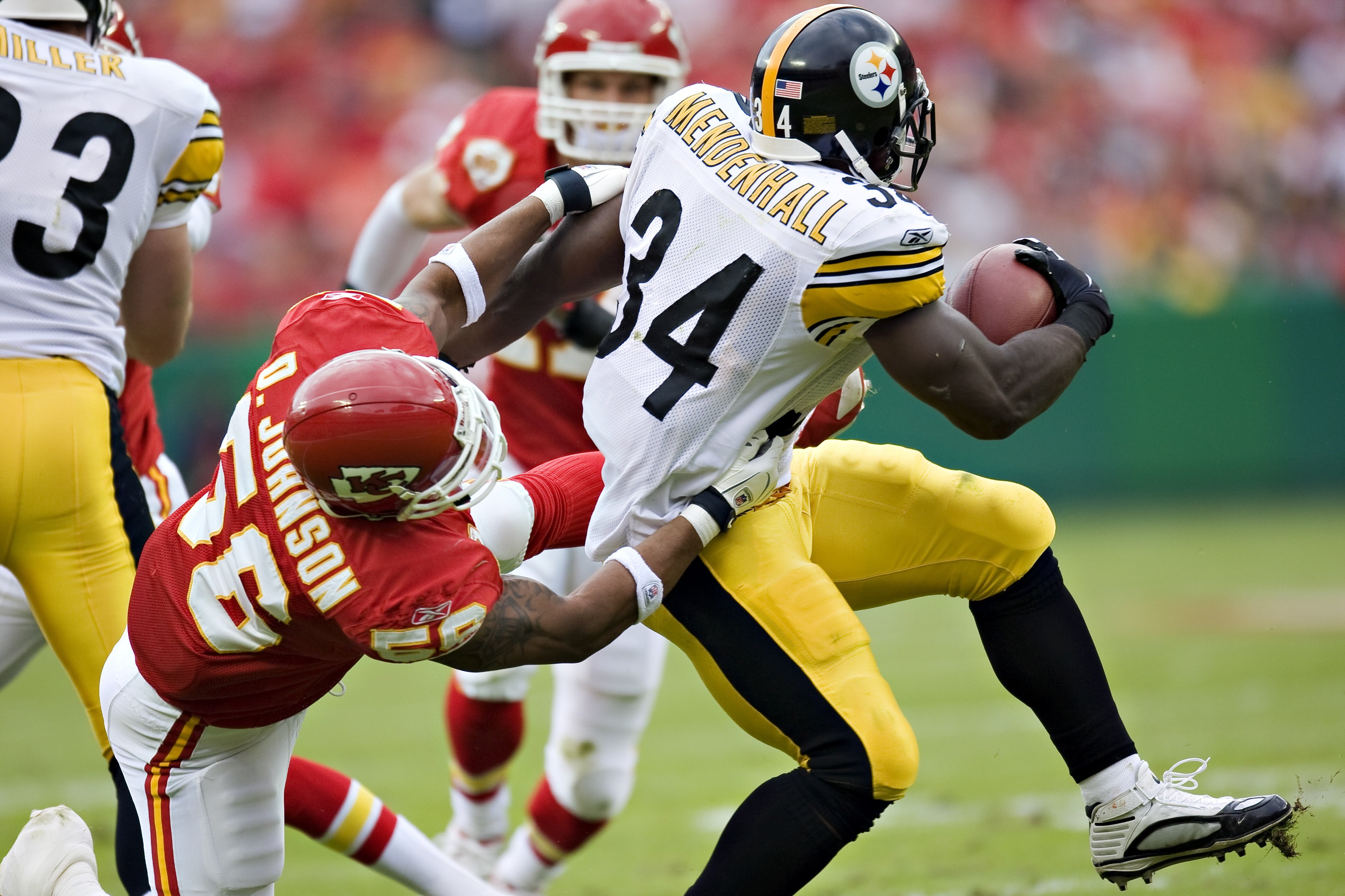 KANSAS CITY, MO - NOVEMBER 22:  Running back Rashard Mendenhall #34 of the Pittsburgh Steelers is tackled by Derrick Johnson #56 of the Kansas City Chiefs at Arrowhead Stadium on November 22, 2009 in Kansas City, Missouri.  The Chiefs defeated the Steeler
