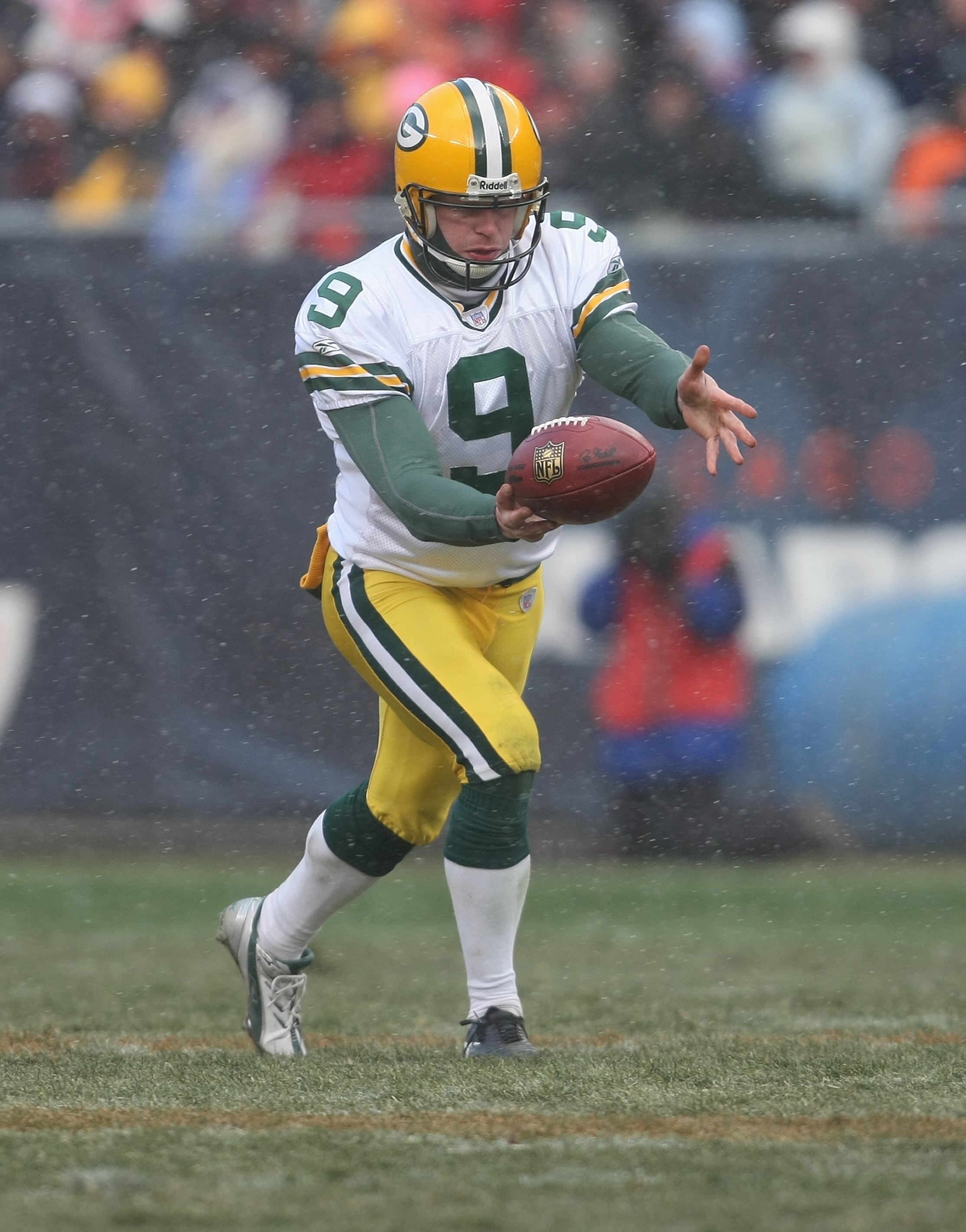 CHICAGO - DECEMBER 23: Jon Ryan #9 of the Green Bay Packers punts the ball against the Chicago Bears on December 23, 2007 at Soldier Field in Chicago, Illinois. The Bears defeated the Packers 35-7. (Photo by Jonathan Daniel/Getty Images)