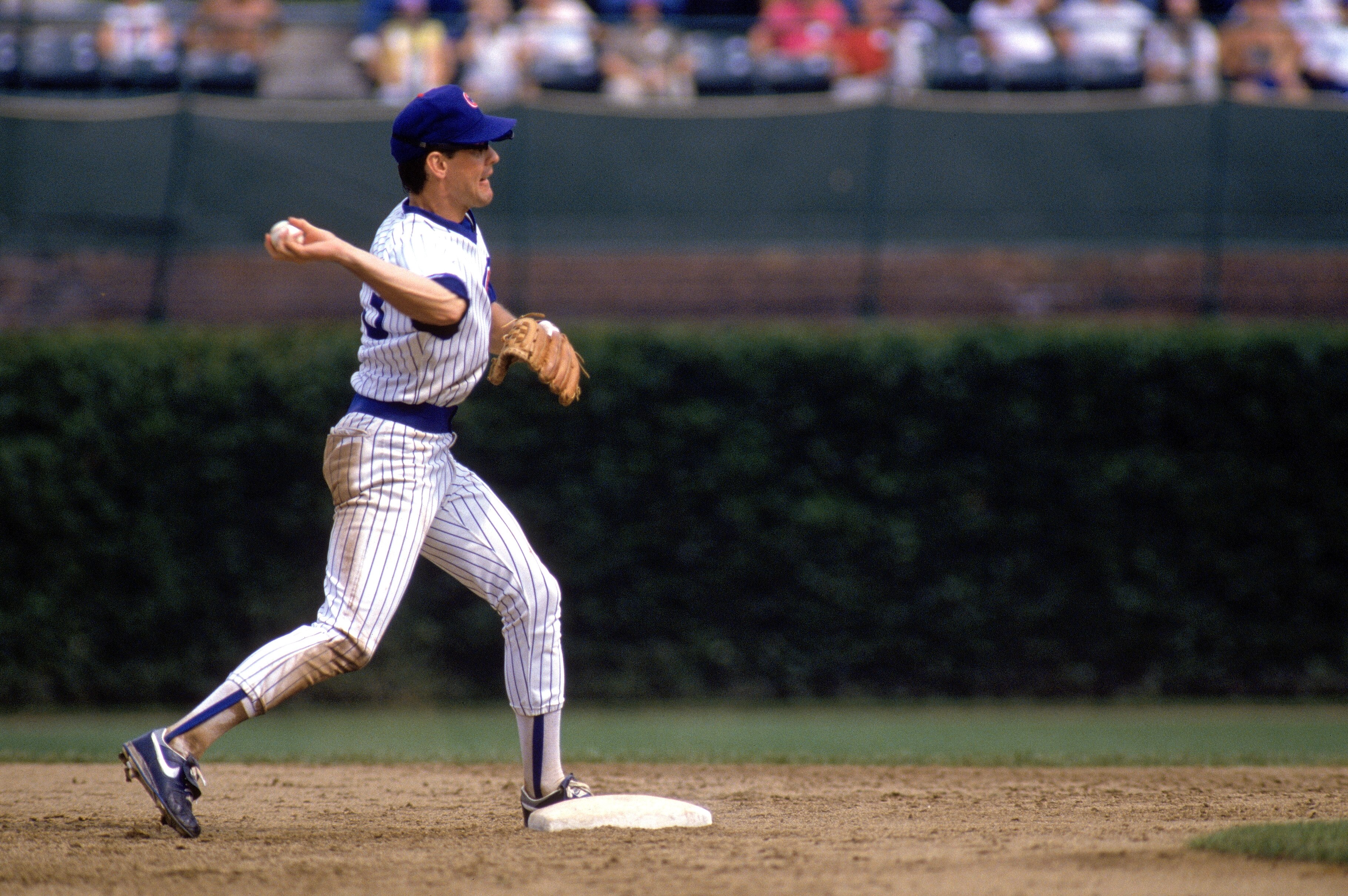 CHICAGO -1989:  Ryne Sandberg #23 of the Chicago Cubs throws the ball to first base during a game in 1989 at Wrigley Field in Chicago, Illinois.  (Photo by Jonathan Daniel/Getty Images)