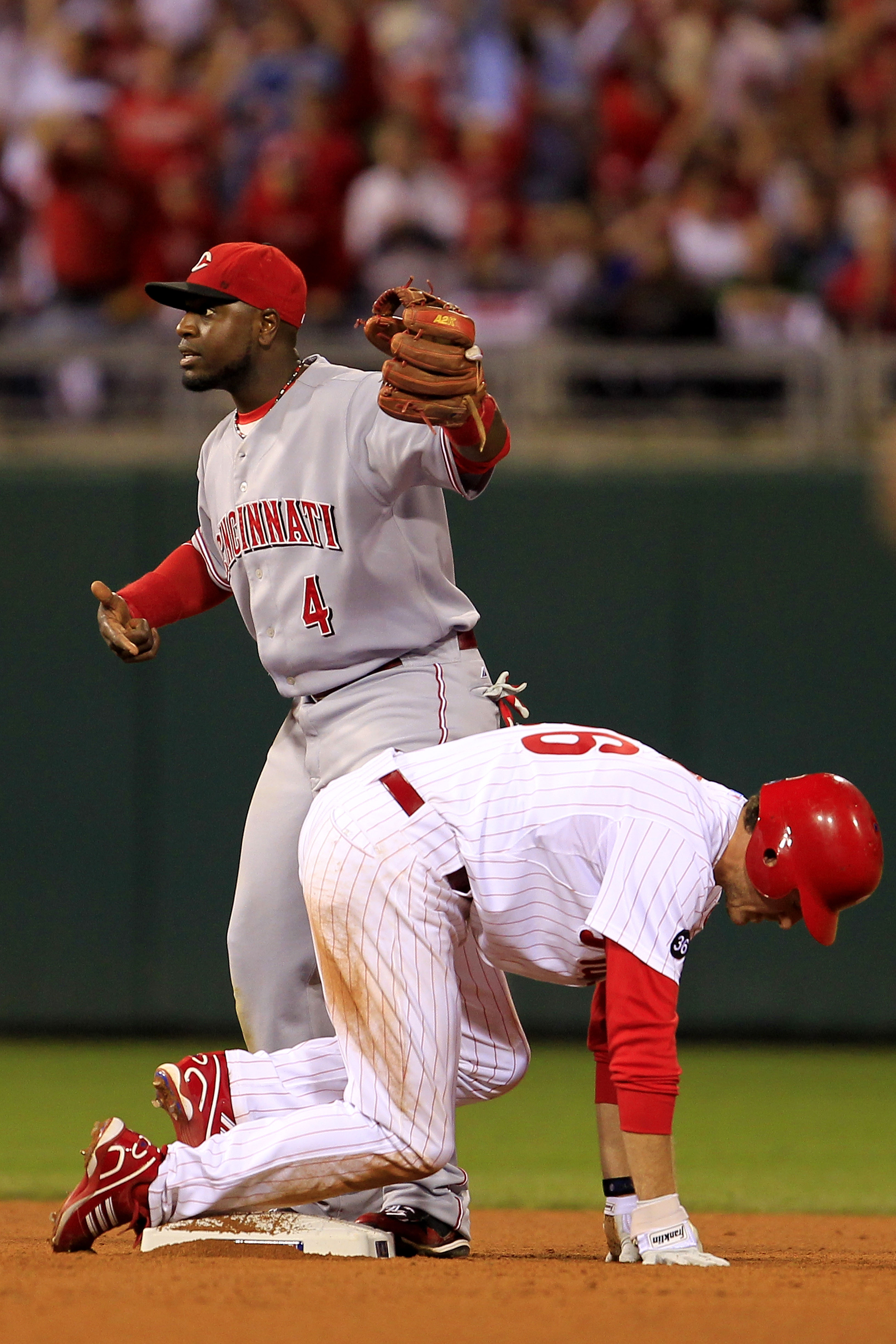 PHILADELPHIA - OCTOBER 08: Brandon Phillips #4 of the Cincinnati Reds reacts after Chase Utley #26 of the Philadelphia Phillies is called safe at second base in the seventh inning of game 2 of the NLDS at Citizens Bank Park on October 8, 2010 in Philadelp
