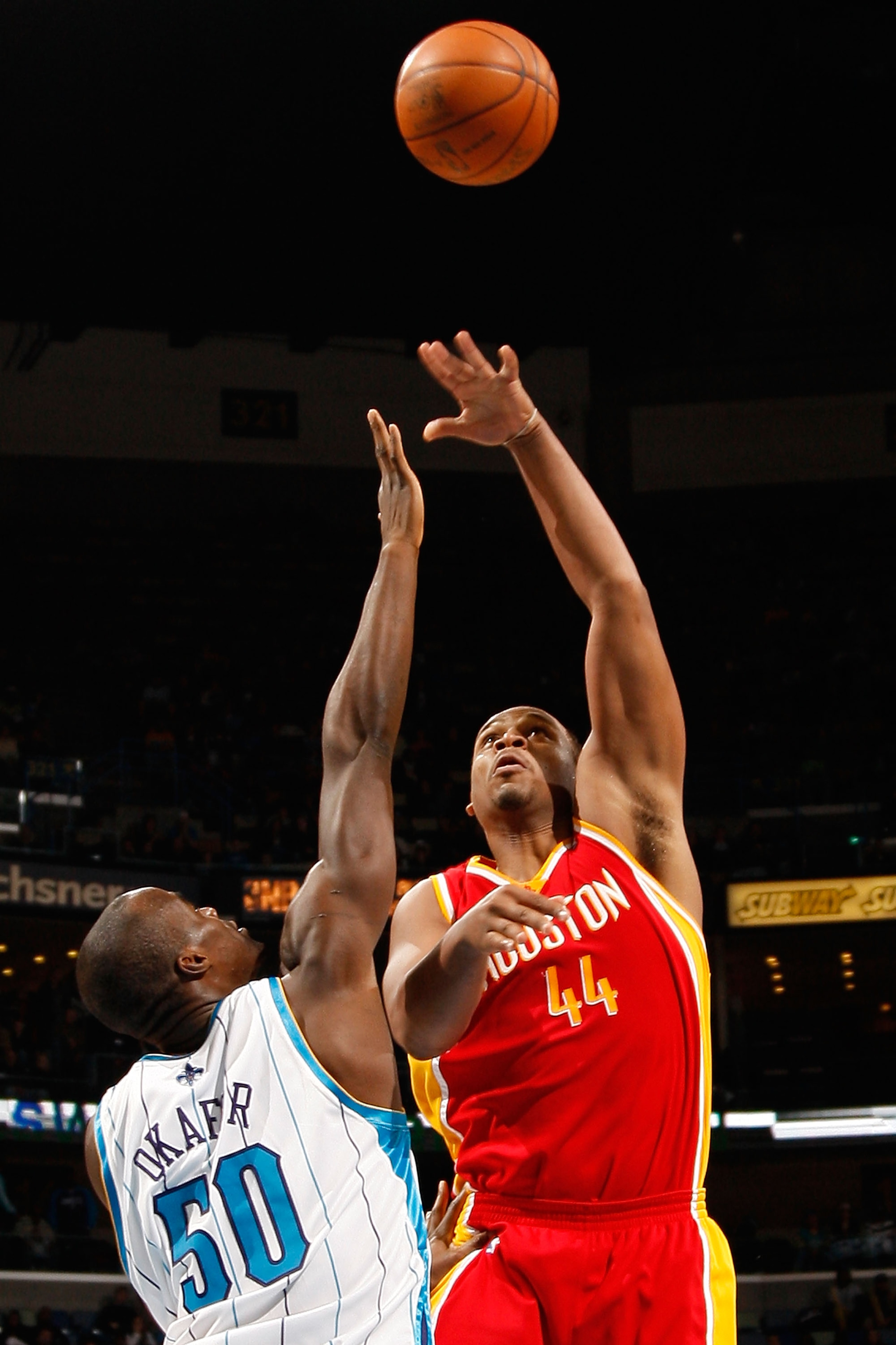 NEW ORLEANS, LA - JANUARY 02:  Chuck Hayes #44 of the Houston Rockets makes a shot over Emeka Okafor #50 of the New Orleans Hornets at the New Orleans Arena on January 2, 2010 in New Orleans, Louisiana.   The Hornets defeated the rockets 99-95.  NOTE TO U
