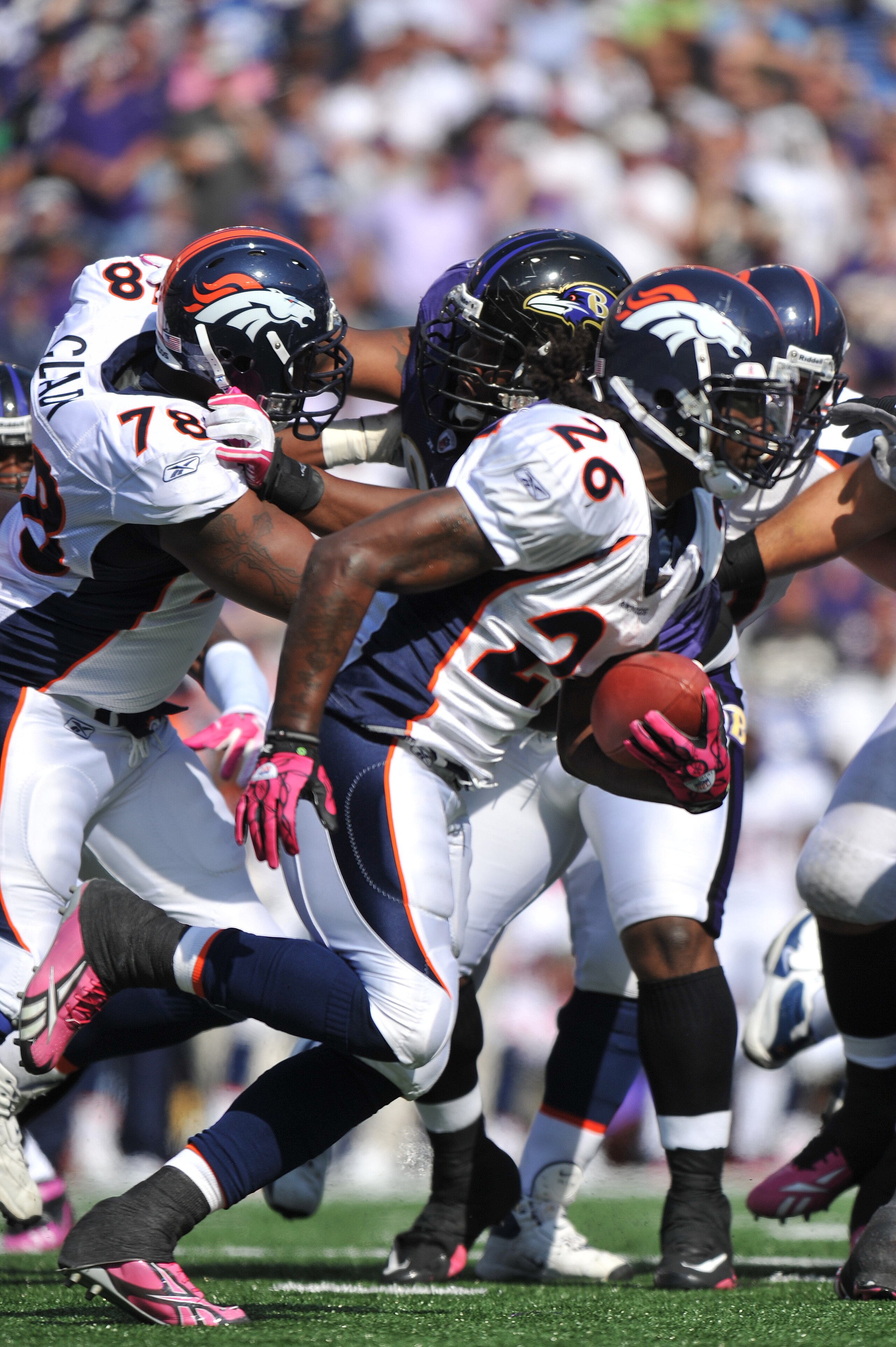 BALTIMORE, MD - OCTOBER 10:  Laurence Maroney #26 of the Denver Broncos runs the ball against the Baltimore Ravens at M&T Bank Stadium on October 10, 2010 in Baltimore, Maryland. Players wore pink in recognition of Breast Cancer Awareness Month. The Raven