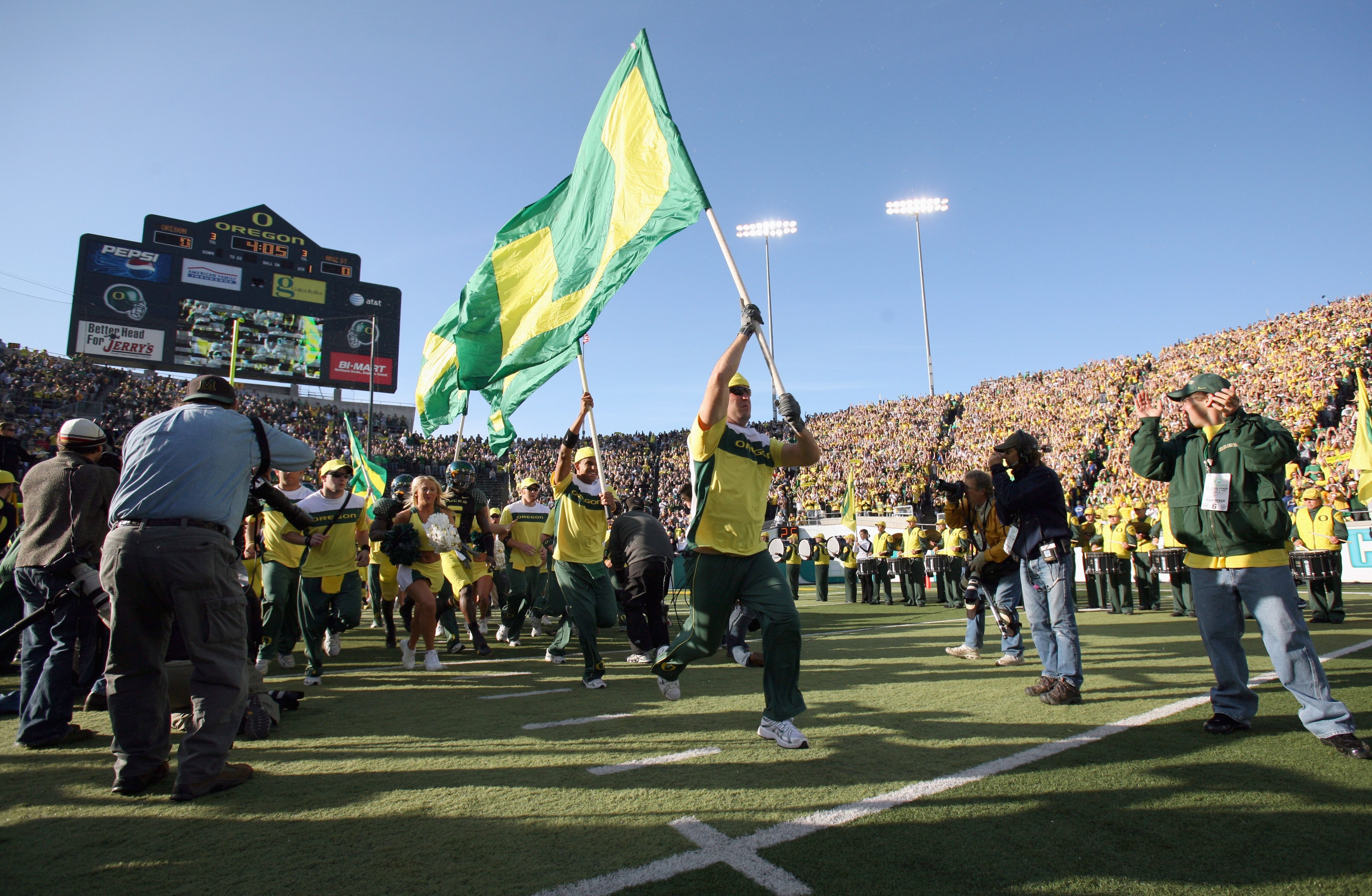 EUGENE, OR - NOVEMBER 03: Cheerleaders of the Oregon Ducks enter the field before the game against the Arizona State Sun Devils at Autzen Stadium on November 3, 2007 in Eugene, Oregon. The Ducks defeated the Sun Devils 35-23. (Photo by Otto Greule Jr/Gett