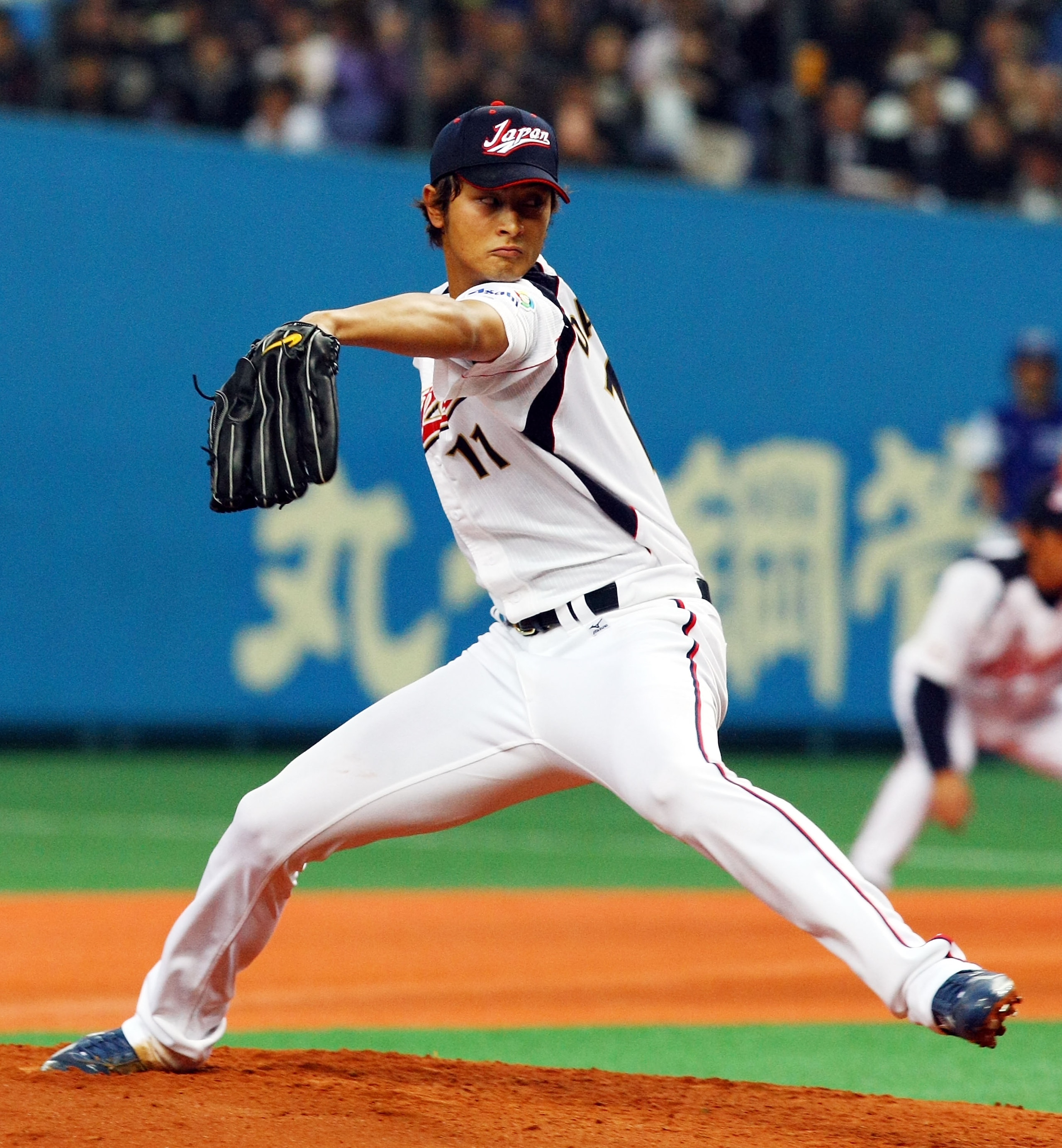 OSAKA, JAPAN - FEBRUARY 24:  Starting Pictcher Yu Darvish #11 of Japan pitches during an exhibition match between Japan and Australia at Kyocera Dome Osaka on February 24, 2009 in Osaka, Japan.  (Photo by Junko Kimura/Getty Images)
