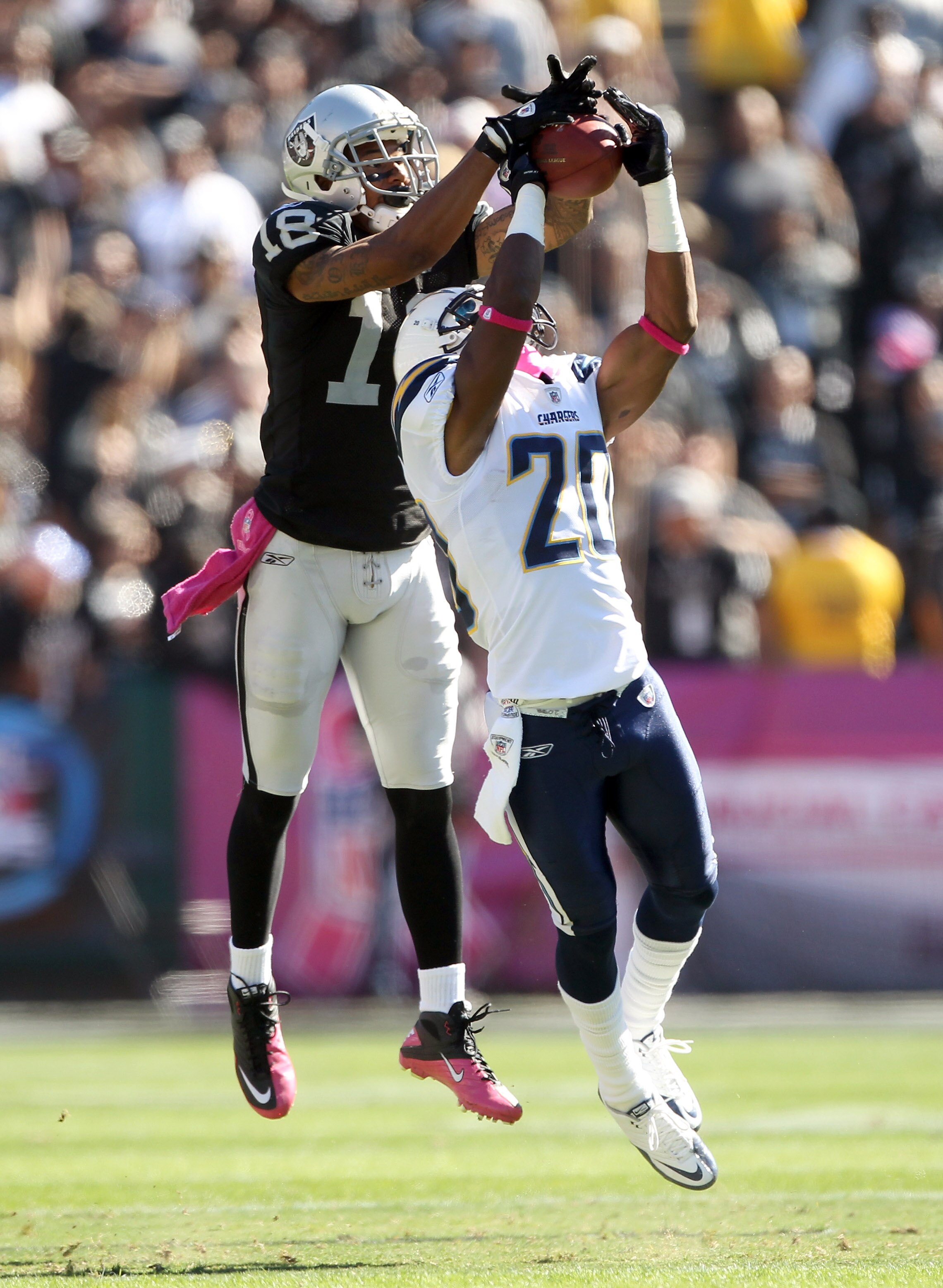 OAKLAND, CA - OCTOBER 10: Antoine Cason #20 of the San Diego Chargers breaks up a pass intended for Louis Murphy #18 of the Oakland Raiders at Oakland-Alameda County Coliseum on October 10, 2010 in Oakland, California. (Photo by Ezra Shaw/Getty Images) OAKLAND, CA - OCTOBER 10: Antoine Cason #20 of the San Diego Chargers breaks up a pass intended for Louis Murphy #18 of the Oakland Raiders at Oakland-Alameda County Coliseum on October 10, 2010 in Oakland, California. (Photo by Ezra Shaw/Getty Images)