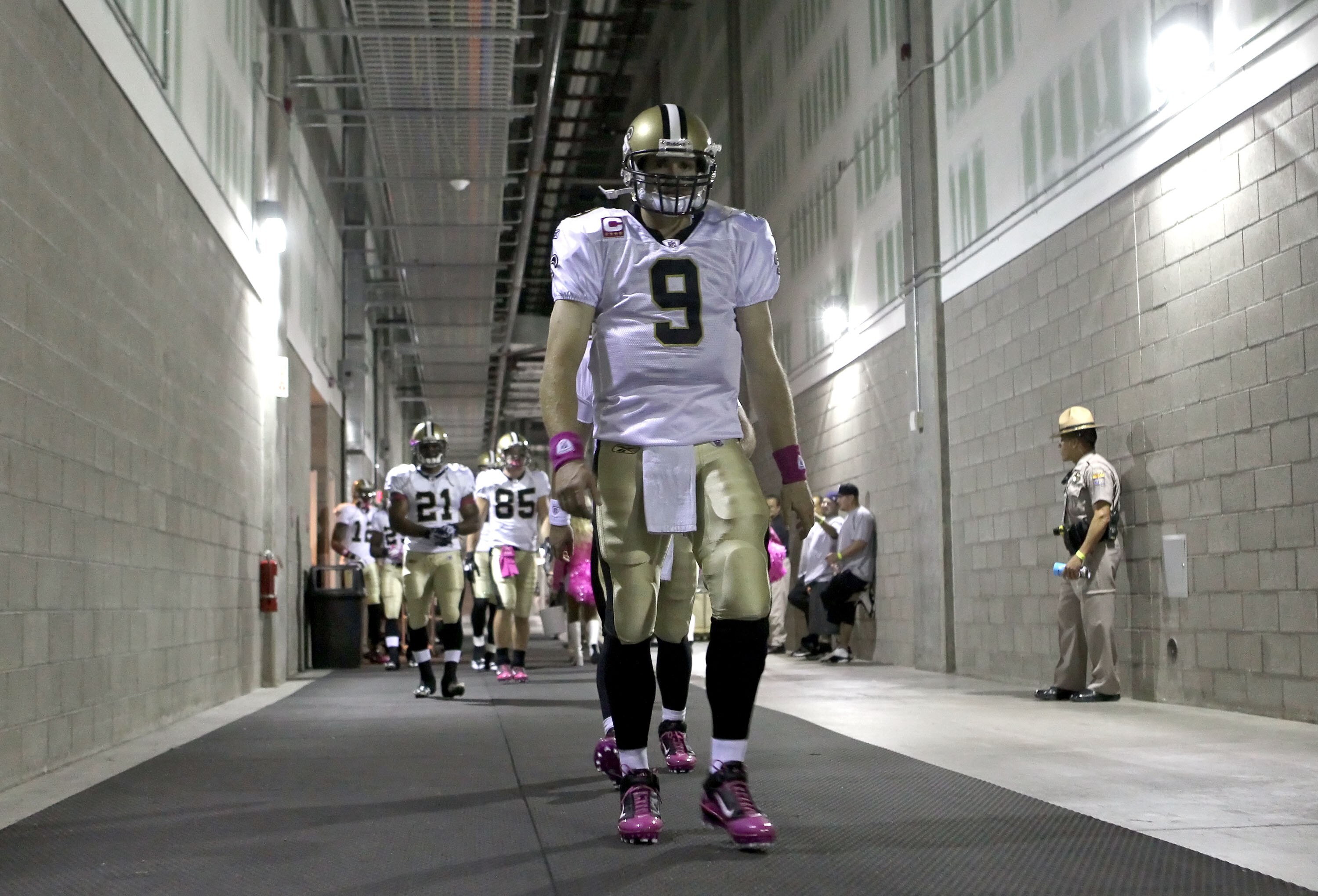 GLENDALE, AZ - OCTOBER 10:  Quarterback Drew Brees #9 of the New Orleans Saints leads teammates out of the locker room before the NFL game against the Arizona Cardinals at the University of Phoenix Stadium on October 10, 2010 in Glendale, Arizona. The Car
