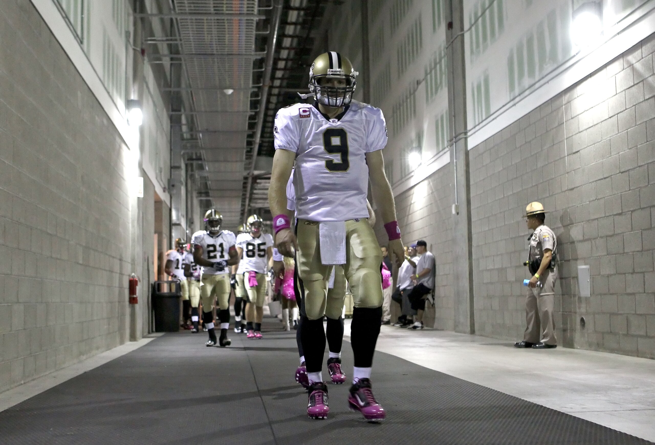 GLENDALE, AZ - OCTOBER 10:  Quarterback Drew Brees #9 of the New Orleans Saints leads teammates out of the locker room before the NFL game against the Arizona Cardinals at the University of Phoenix Stadium on October 10, 2010 in Glendale, Arizona. The Car