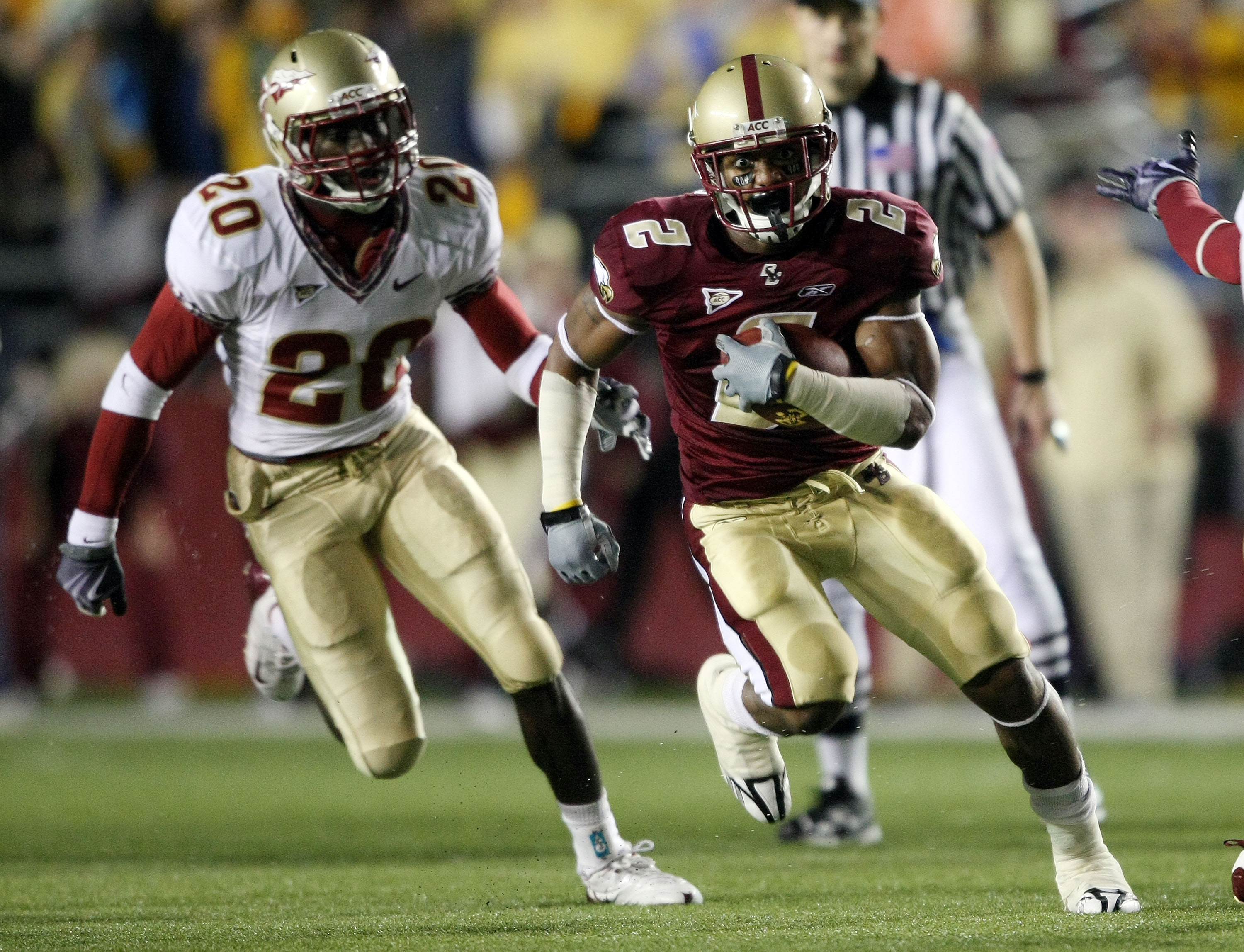 CHESTNUT HILL, MA - OCTOBER 03:  Montel Harris #2  of the Boston College Eagles gets past Jamie Robinson #20 of the Florida State Seminoles and carries the ball 42 yards to score the game winning touchdown on October 3, 2009 at Alumni Stadium in Chestnut