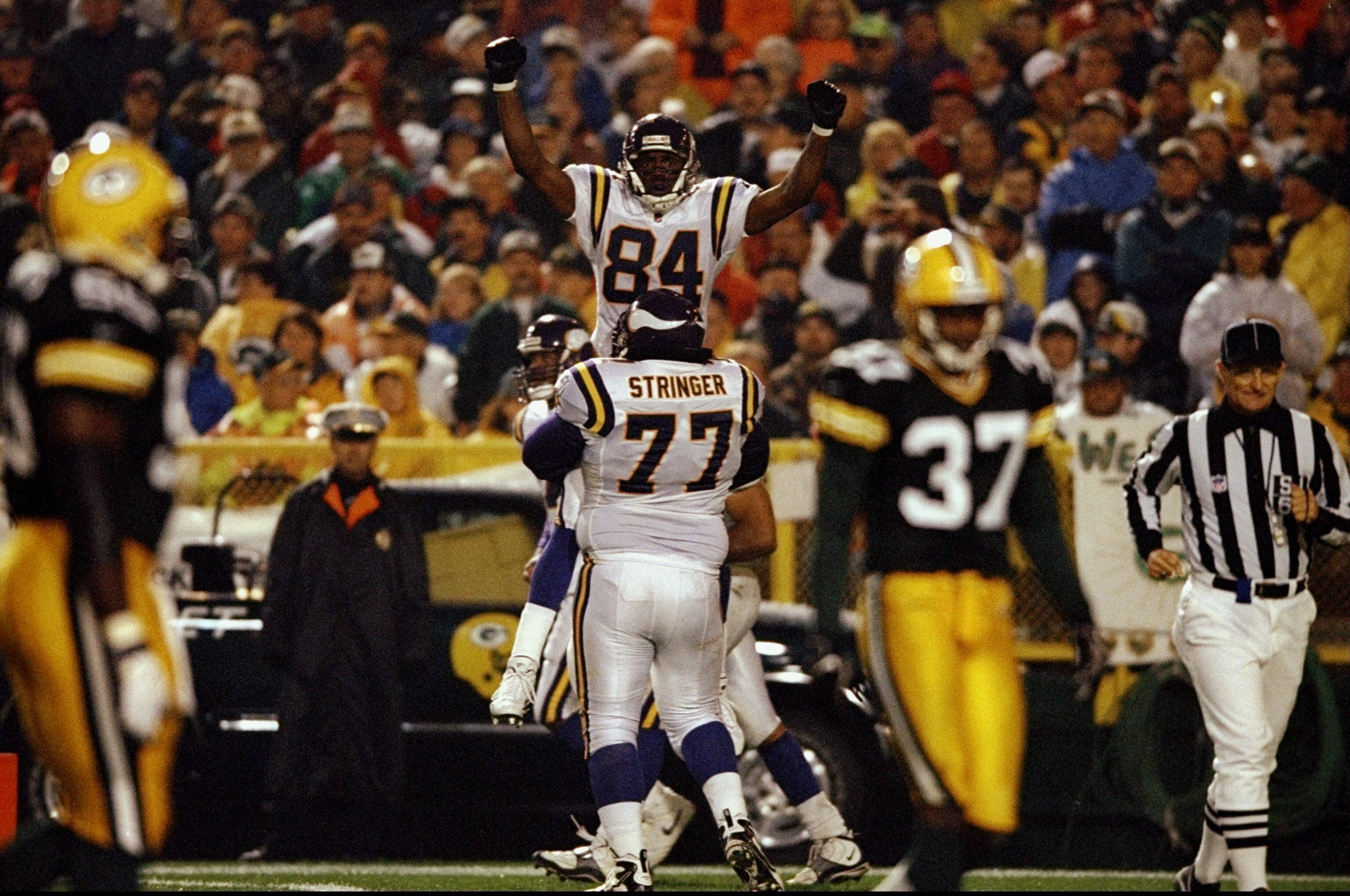 5 Oct 1998:  Wide receiver Randy Moss #84 and tackle Korey Stringer #77 of the Minnesota Vikings celebrate during a game against the Green Bay Packers at the Lambeau Field in Green Bay, Wisconsin. The Vikings defeated the Packers 37-24.