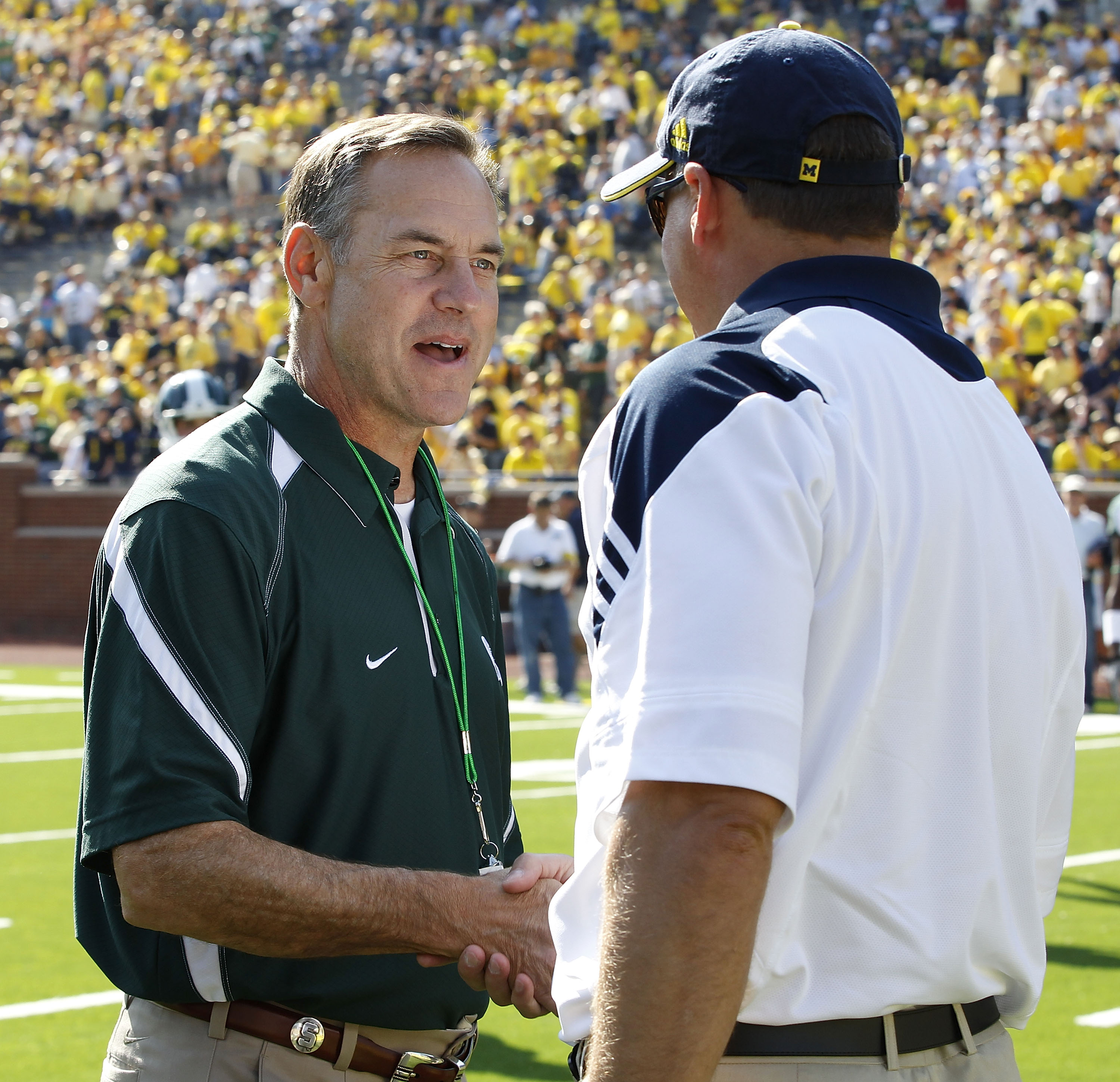 ANN ARBOR, MI - OCTOBER 09: Michigan State head coach Mark Dantonio and Michigan head coach Rich Rodriguez meet prior to the start of the game October 9, 2010 at Michigan Stadium in Ann Arbor, Michigan. (Photo by Leon Halip/Getty Images)