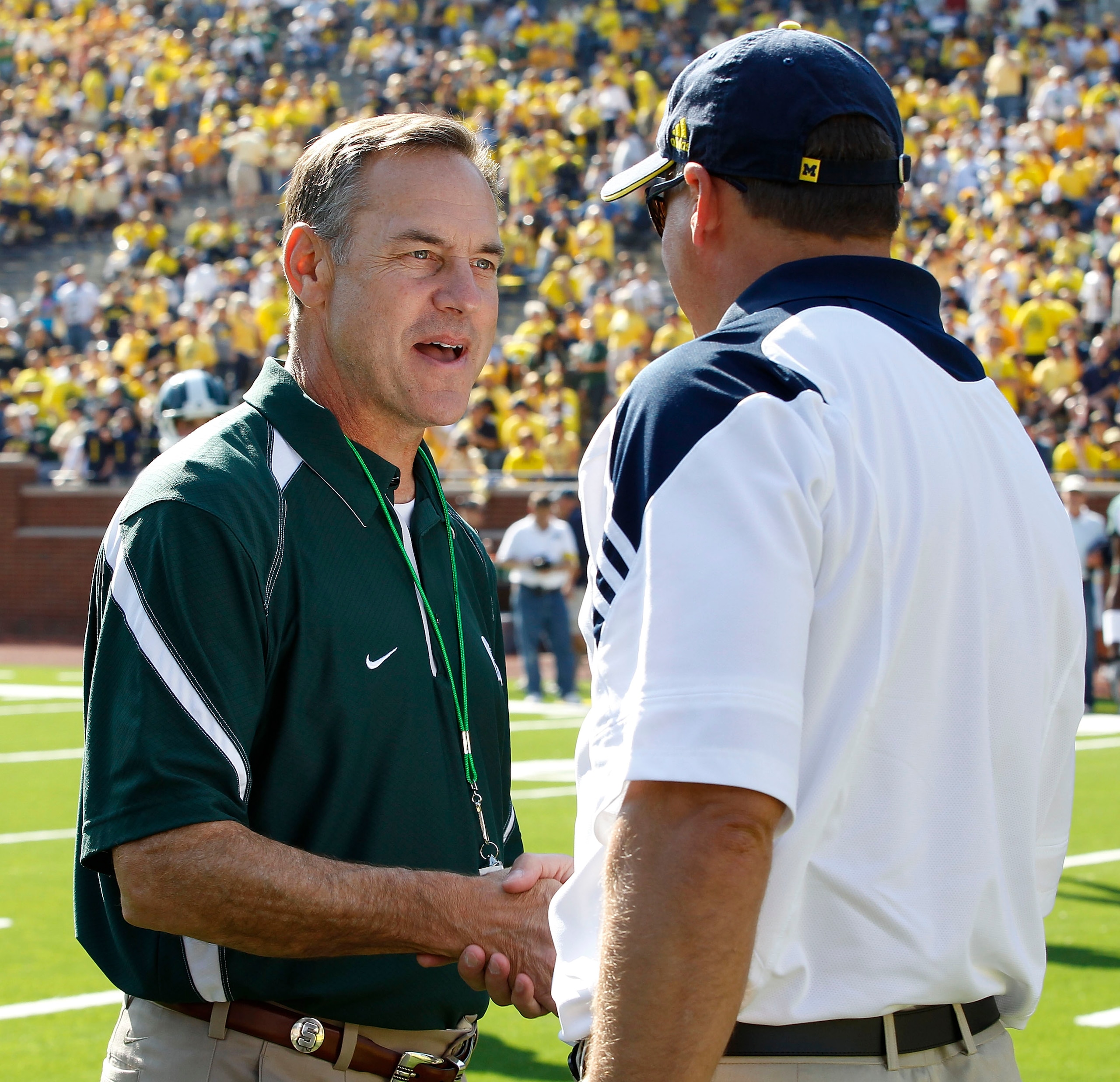ANN ARBOR, MI - OCTOBER 09: Michigan State head coach Mark Dantonio and Michigan head coach Rich Rodriguez meet prior to the start of the game October 9, 2010 at Michigan Stadium in Ann Arbor, Michigan. (Photo by Leon Halip/Getty Images)