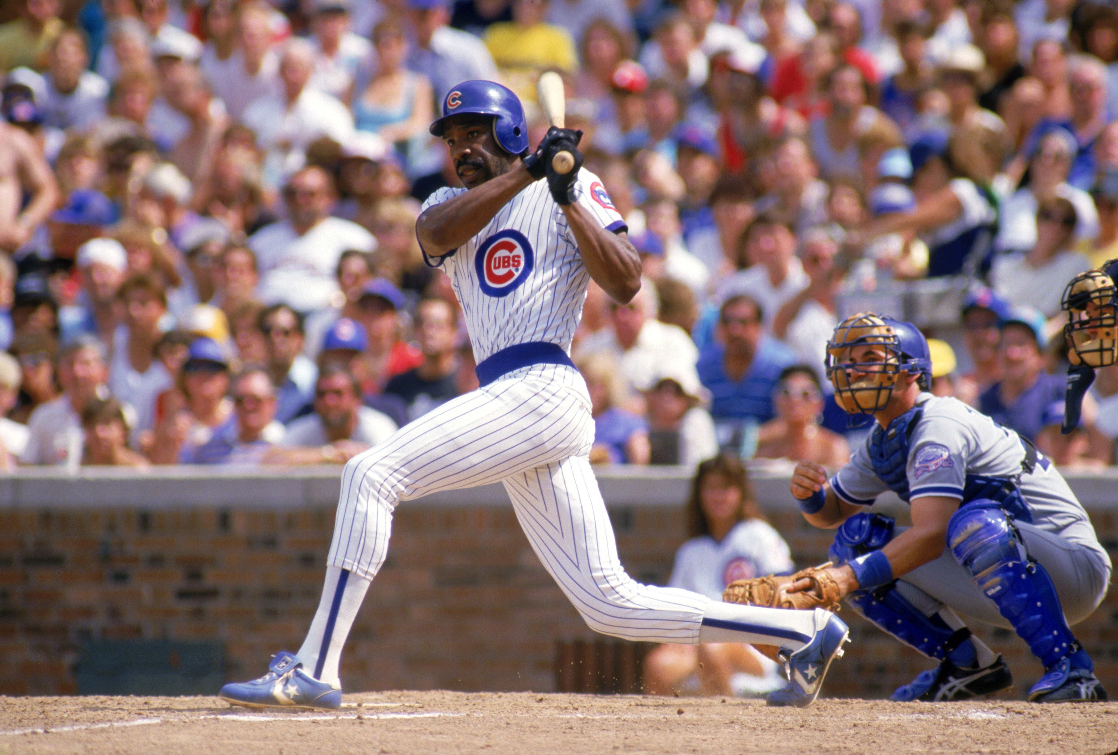 CHICAGO - 1987:  Andre Dawson #8 of the Chicago Cubs follows through on his swing during a game with the Los Angeles Dodgers in 1987 at Wrigley Field in Chicago, Illinois.  (Photo by Jonathan Daniel/Getty Images)